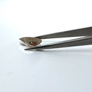 Oregon sunstone faceted pear fantasy cut gemstone, 4.88ct, held in tweezers, view 10 of 10
