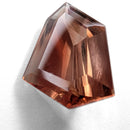Oregon Sunstone faceted freeform step cut gemstone, 6.70ct, from Plush, Oregon, on a white background, view 1 of 10