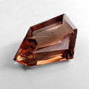 Oregon Sunstone faceted freeform step cut gemstone, 6.70ct, from Plush, Oregon, on a white background, view 6 of 10