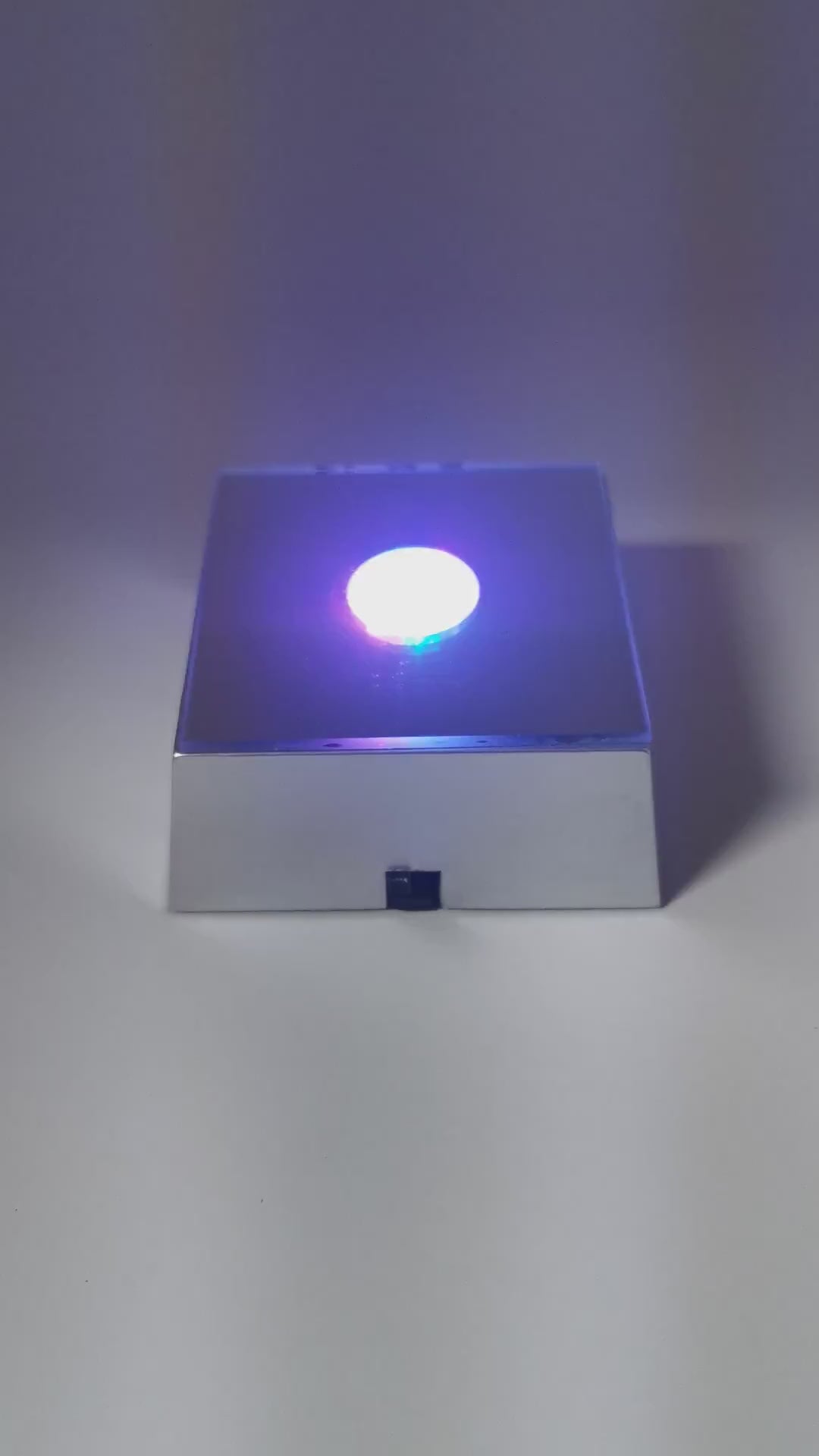 LED Light Base display, made of plastic.