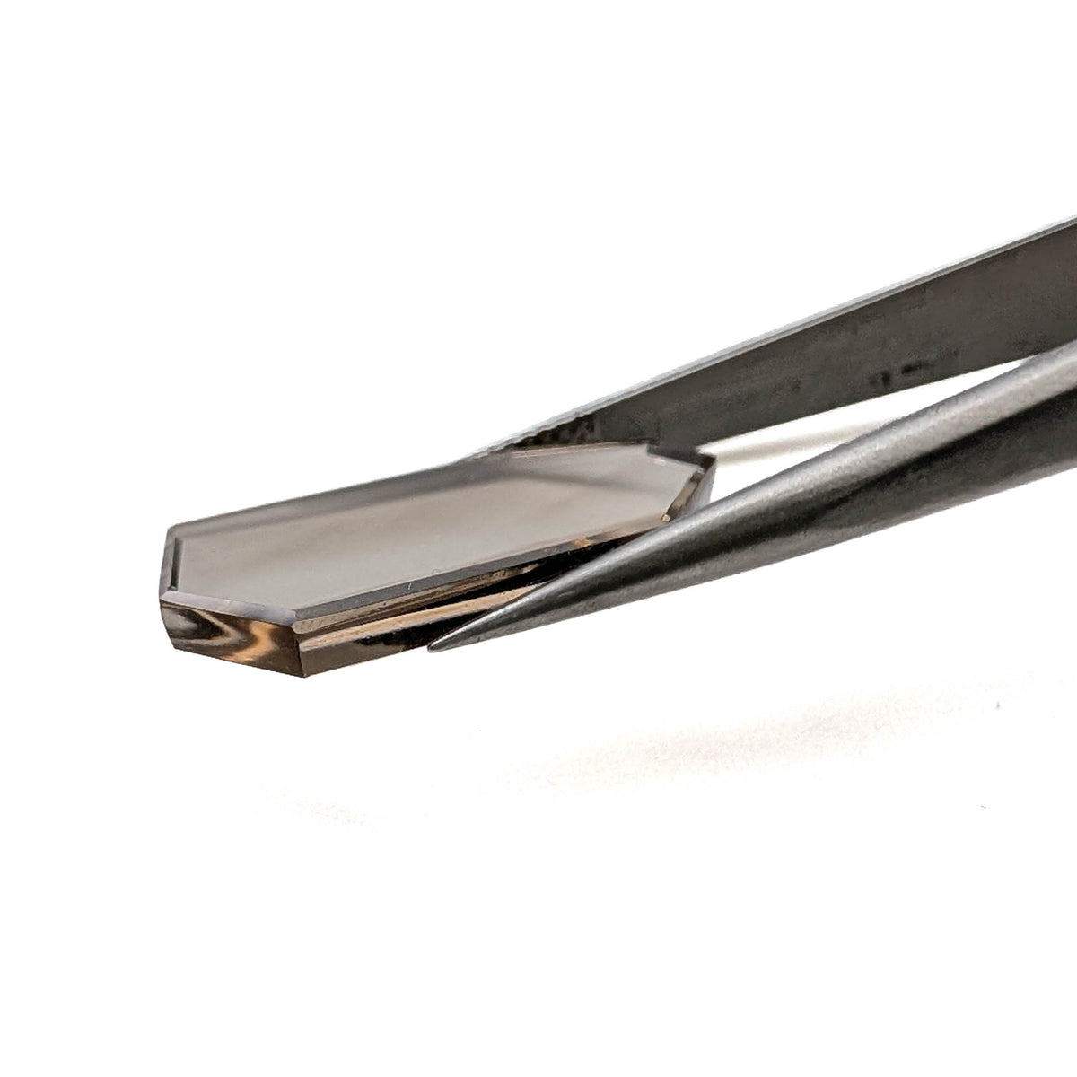 Smoky Quartz faceted freeform flatback step cut gemstone, 9.03ct, from Minas Gerais, Brazil, held in tweezers, view 9 of 10