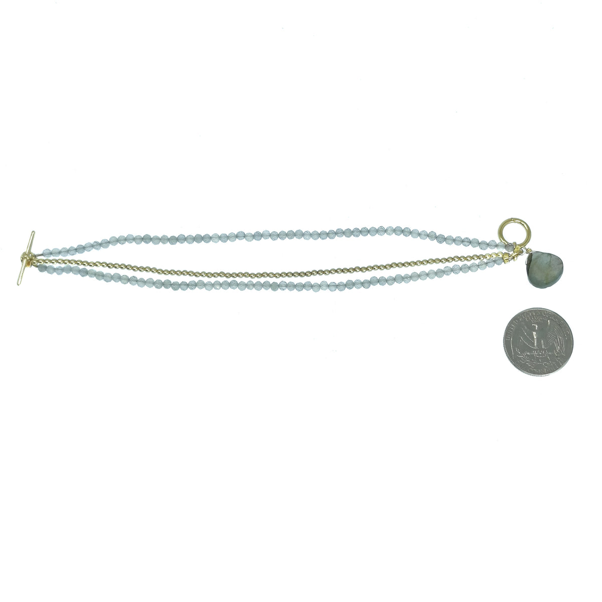 10kt gold plated labradorite bracelet – bracelet beside a coin