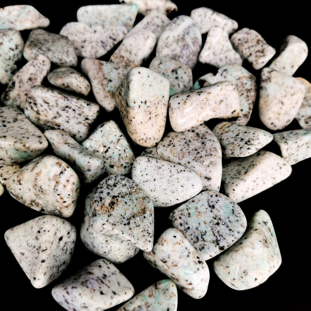 Amazonite tumble, a variety of microcline feldspar, from Boston Bar, British Columbia, Canada.