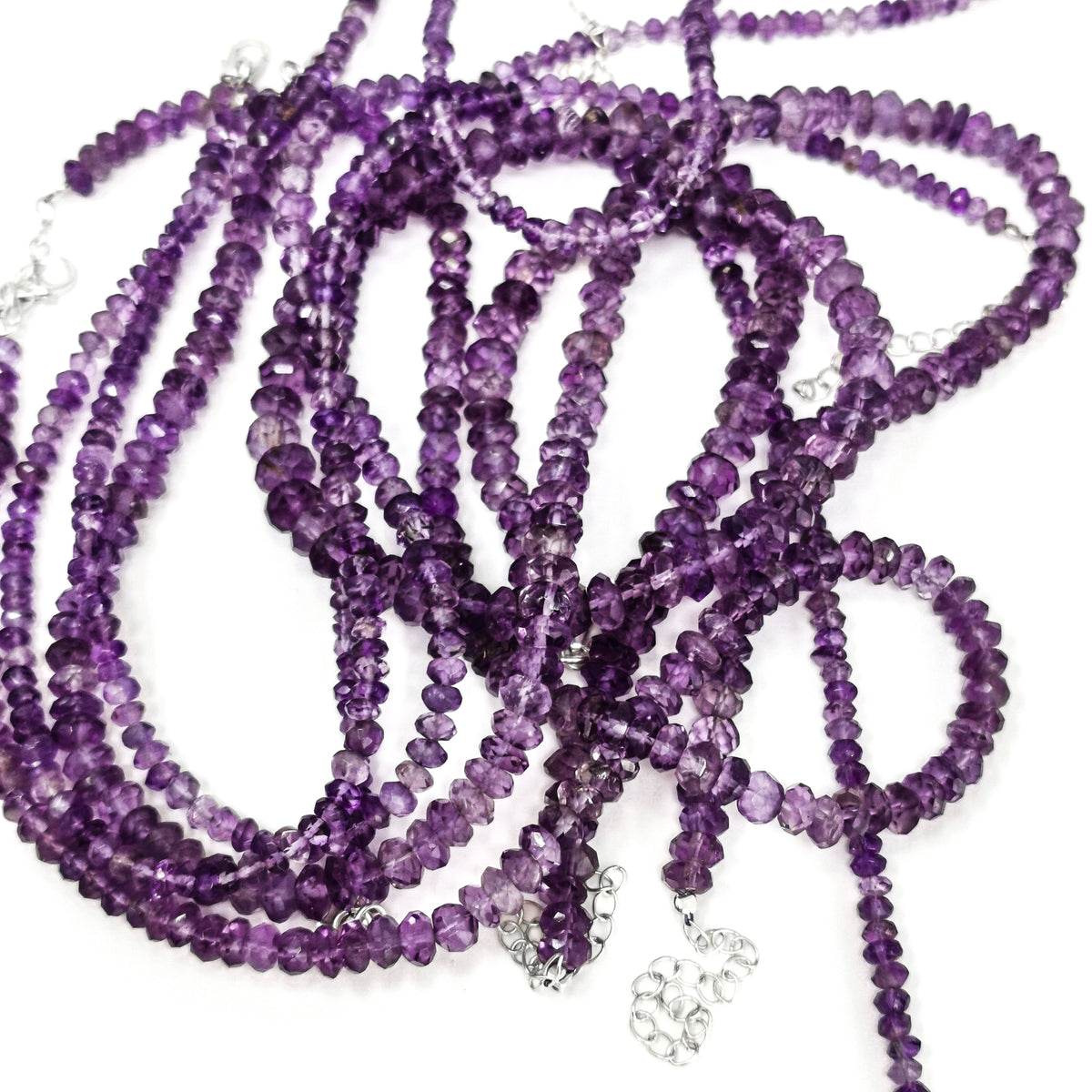 Amethyst facet bead necklace in sterling silver and steel wire.