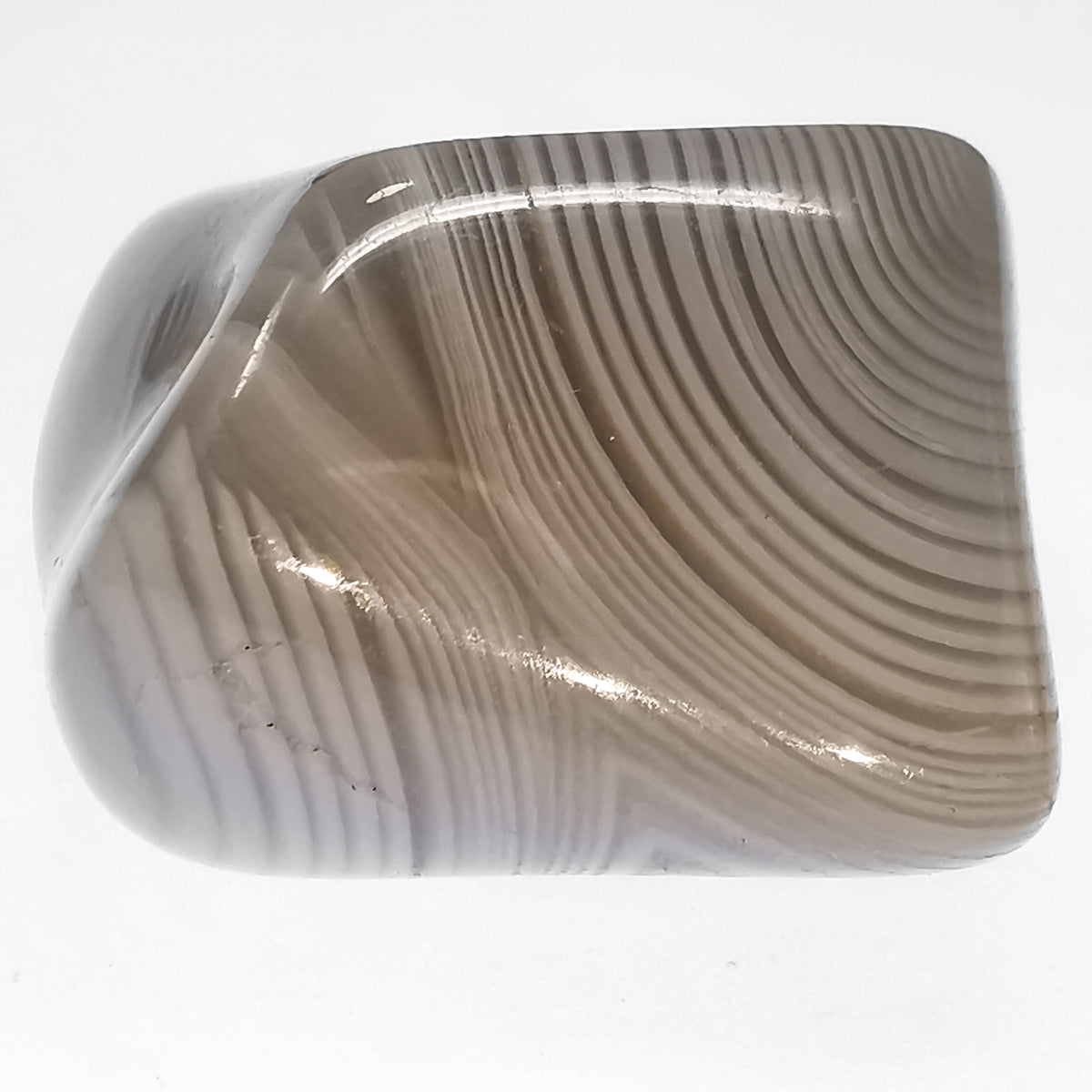 Banded Agate tumble, a variety of chalcedony, from Madagascar.