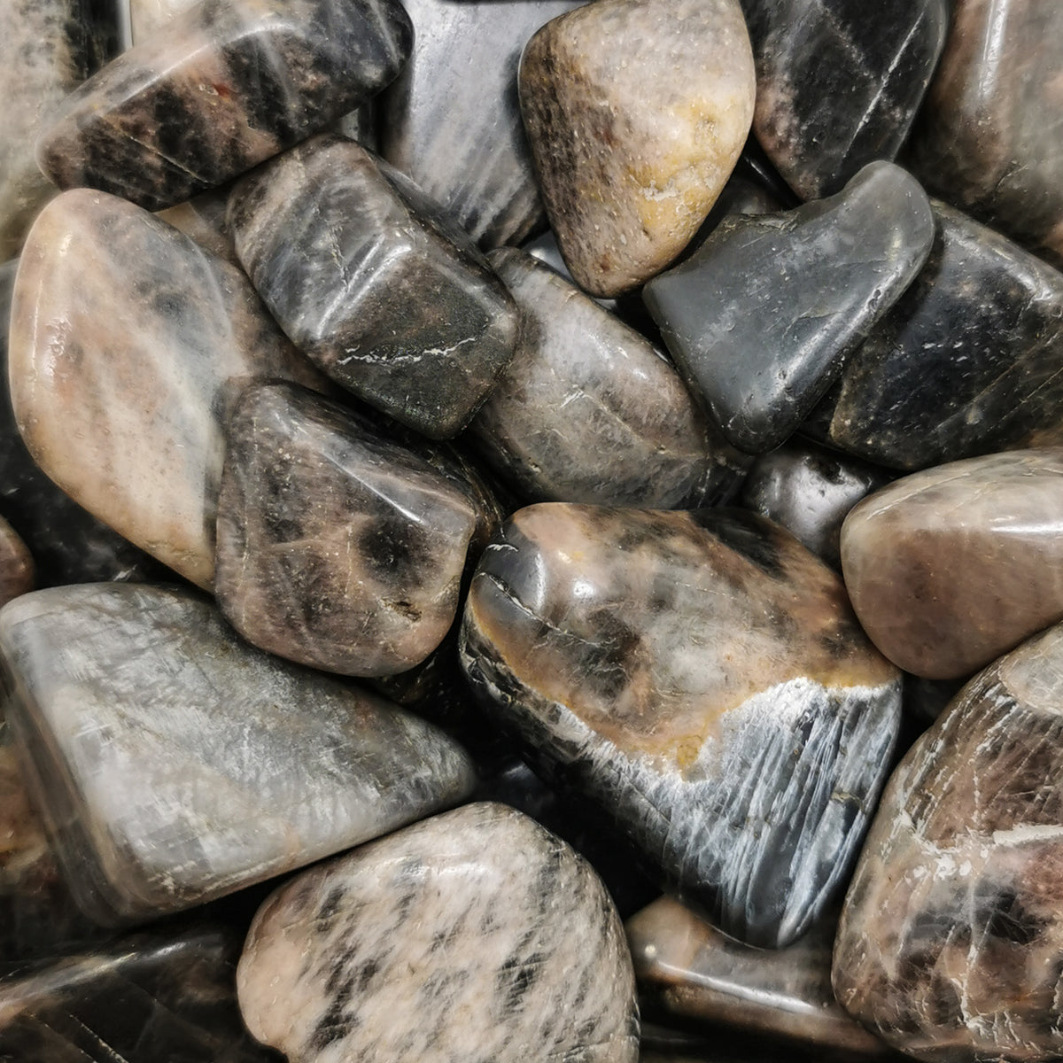 Black Moonstone tumble, a feldspar, from Madagascar.