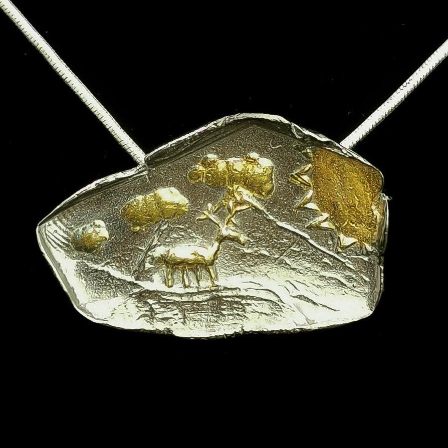 Caribou pendant.