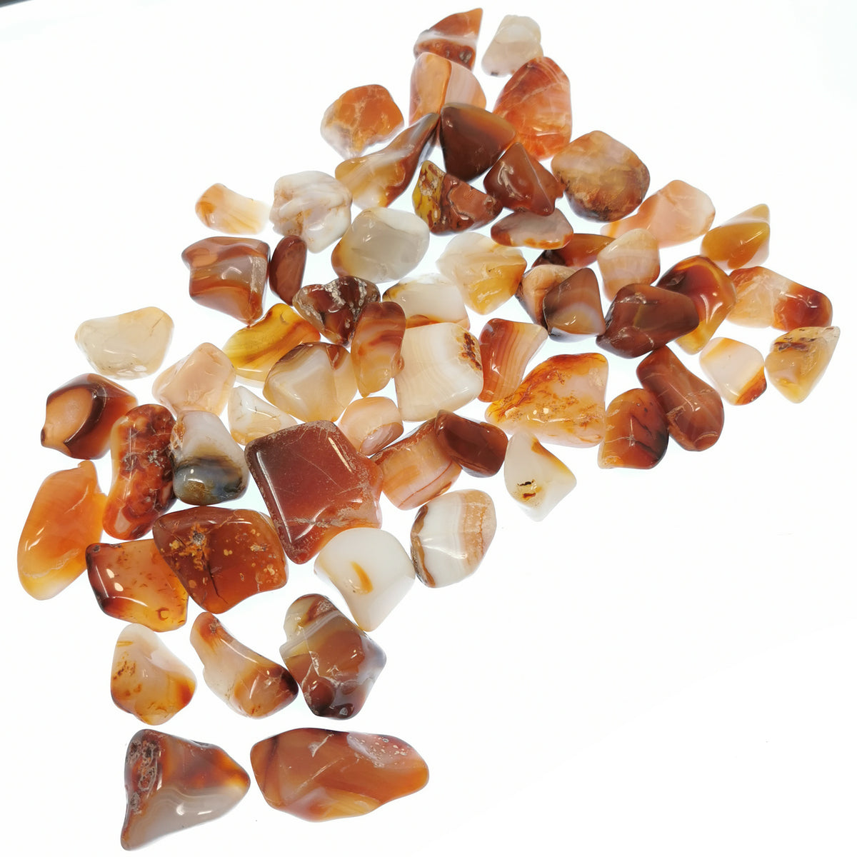 Carnelian B-grade tumble, a variety of chalcedony, from Ambato-Boeni District, Mahajanga Province, Madagascar.
