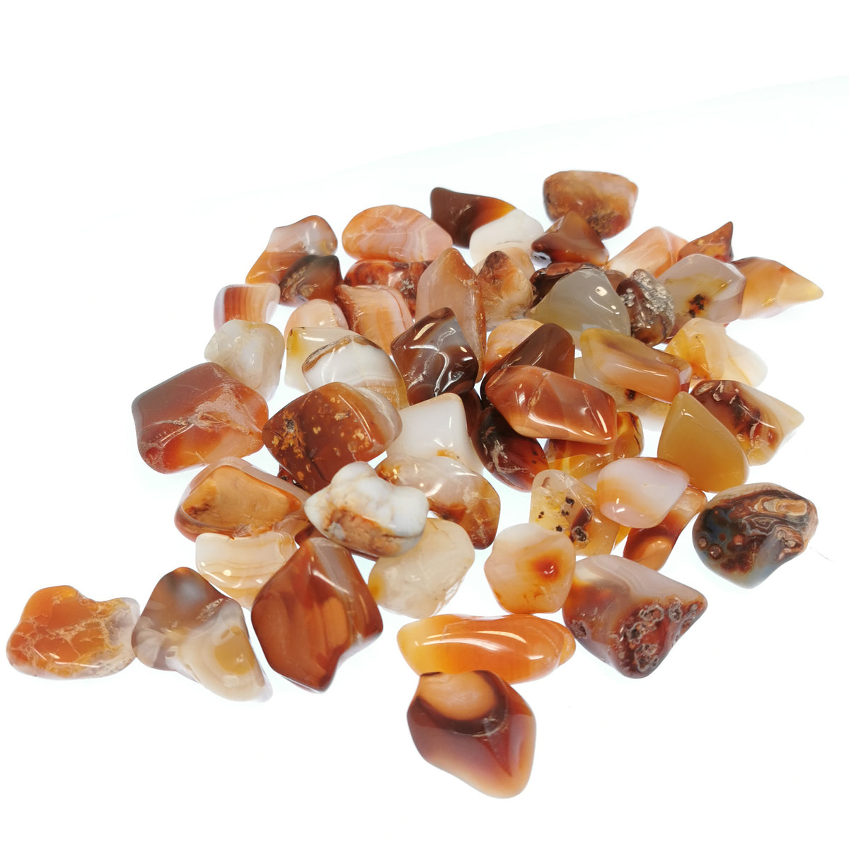 Carnelian B-grade tumble, a variety of chalcedony, from Ambato-Boeni District, Mahajanga Province, Madagascar.