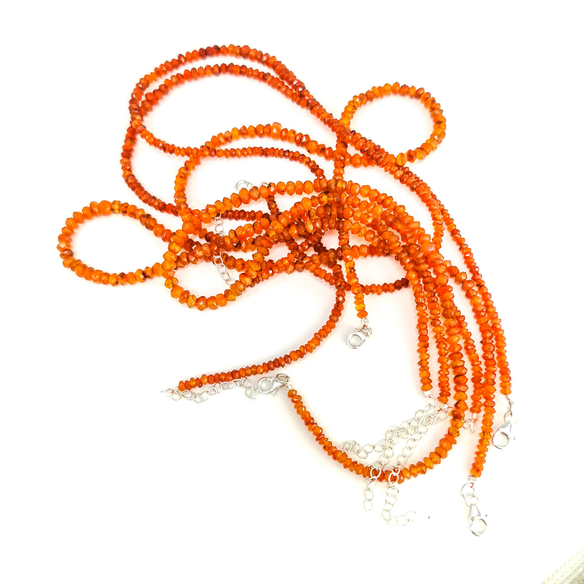 Carnelian facet bead necklace in sterling silver and steel wire.