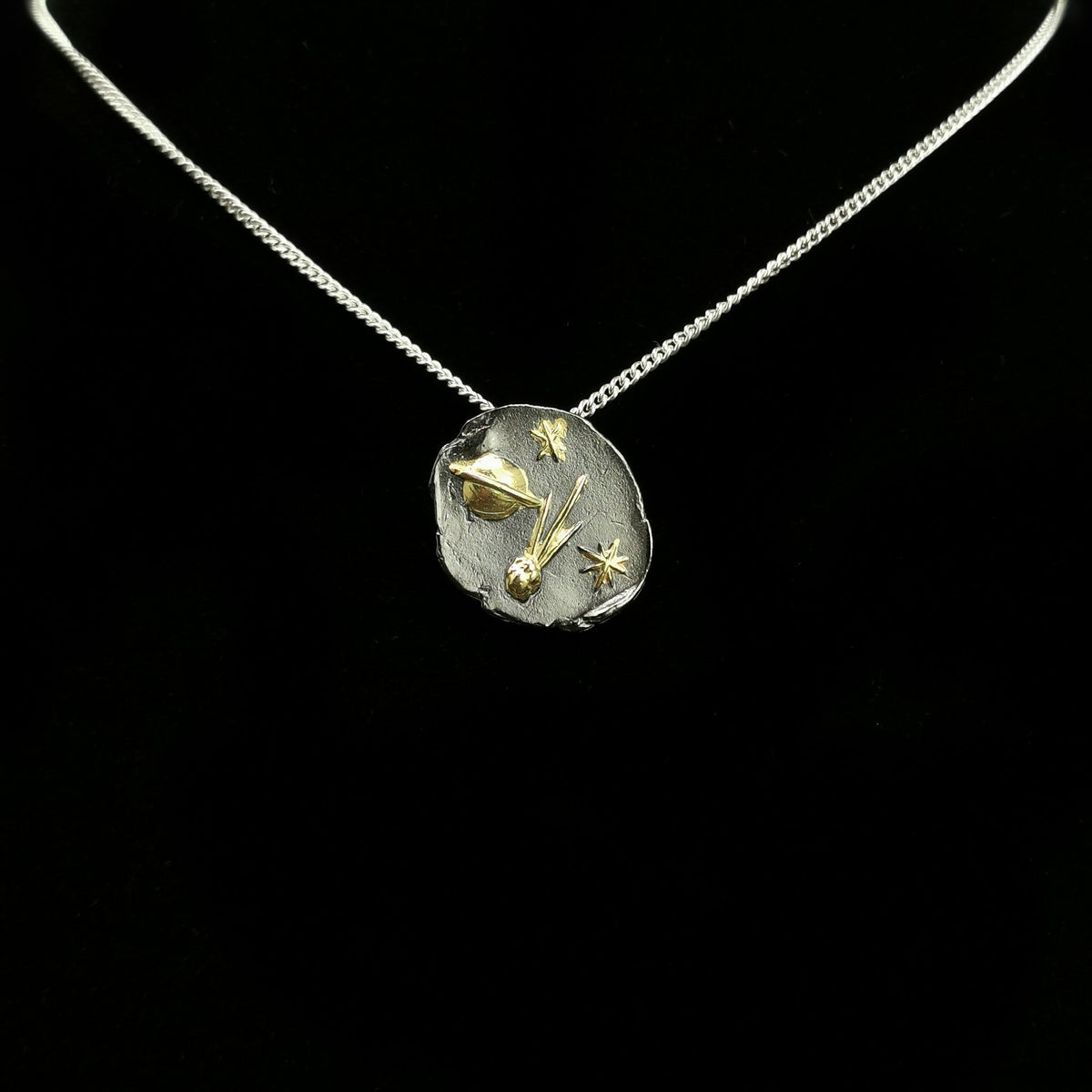 Comet pendant.