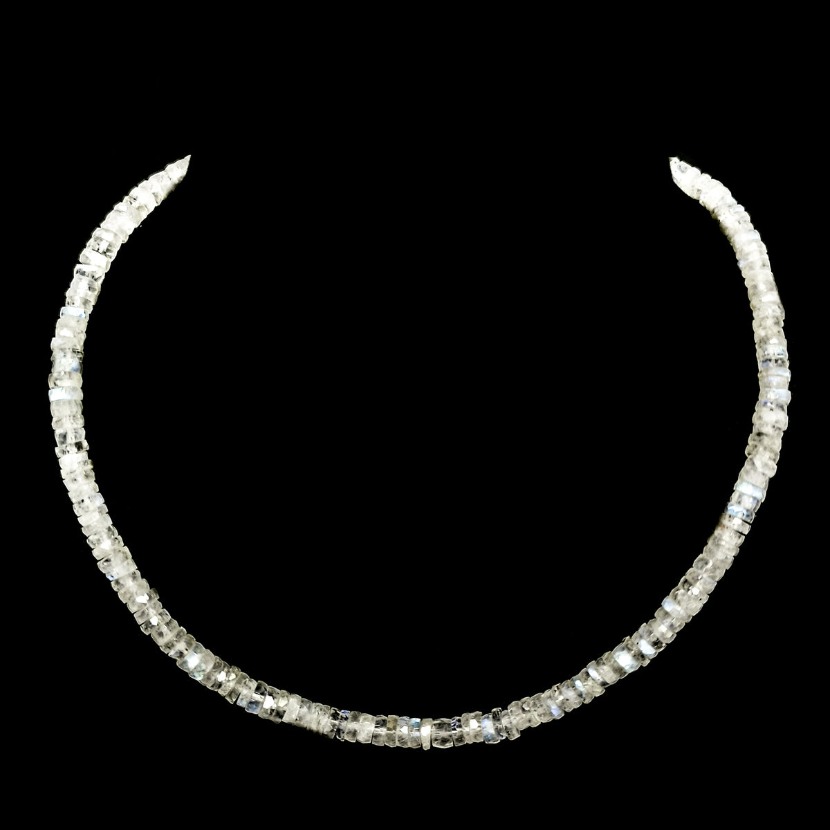 Wheel Shape facet bead necklace in sterling silver and steel wire.