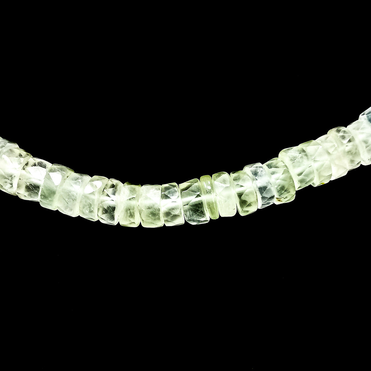 Wheel Shape facet bead necklace in sterling silver and steel wire.