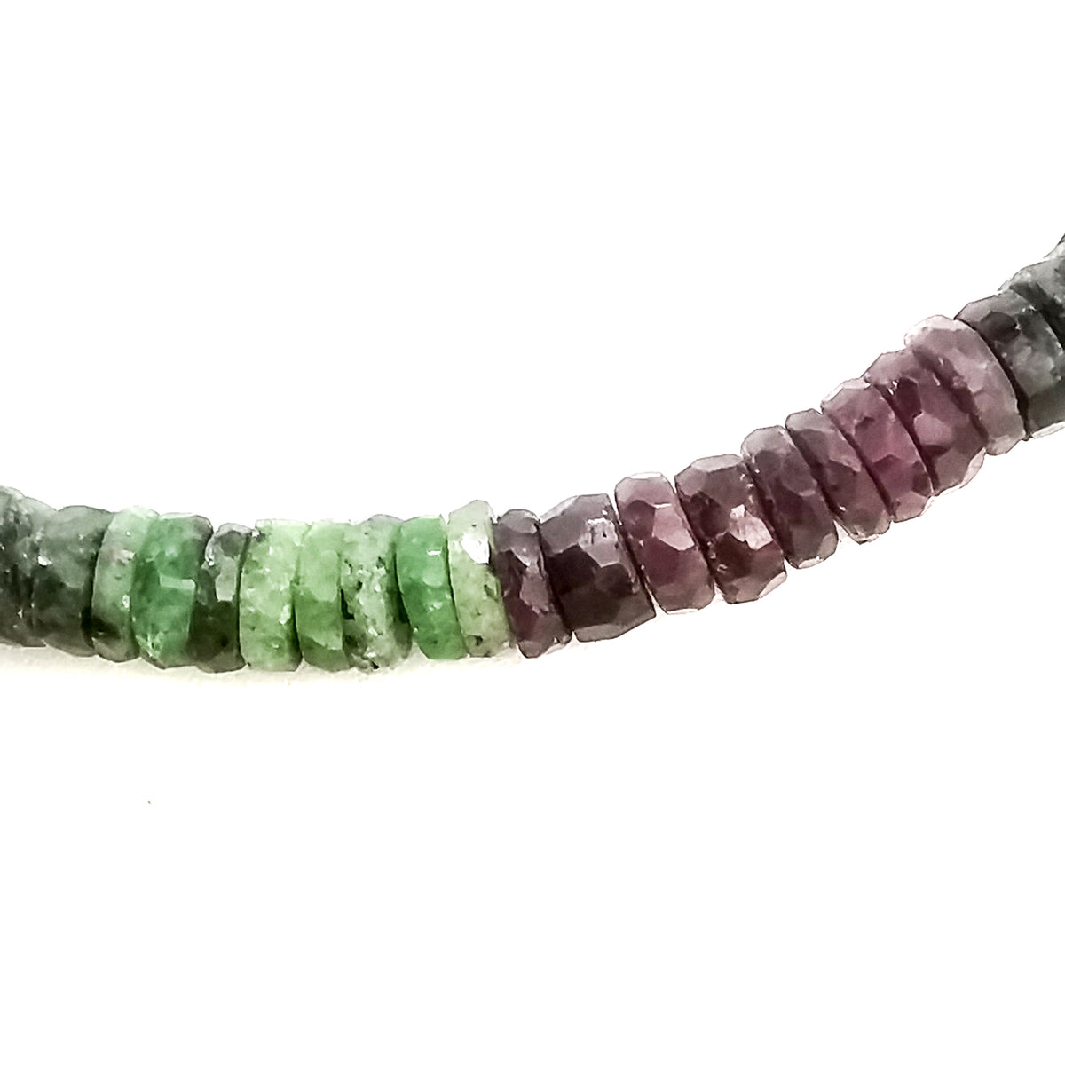 Wheel Shape facet bead necklace in sterling silver and steel wire.