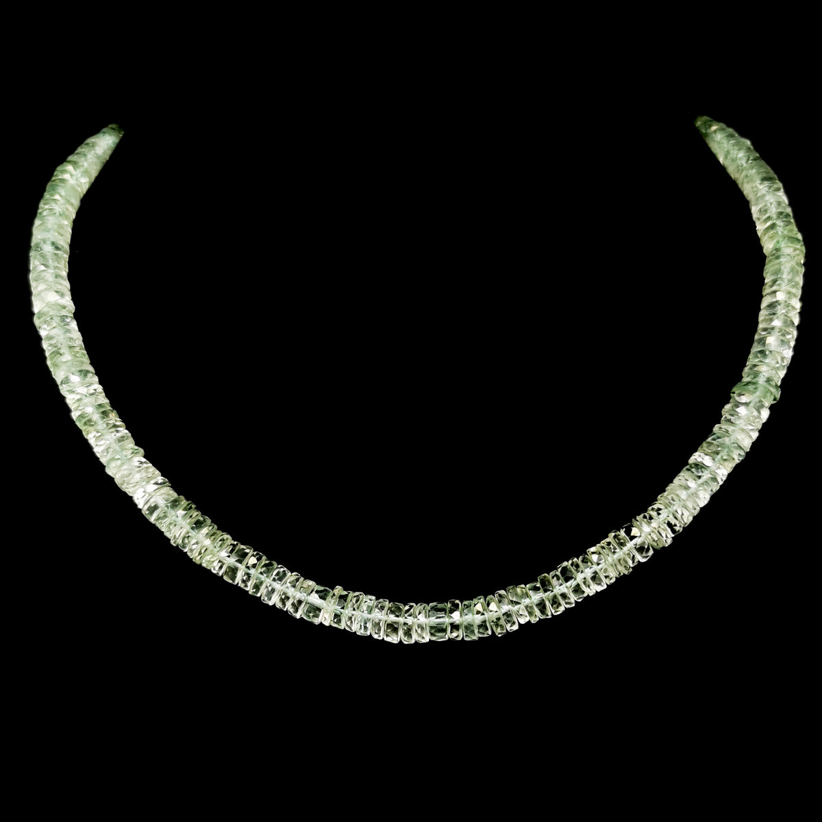 Wheel Shape facet bead necklace in sterling silver and steel wire.