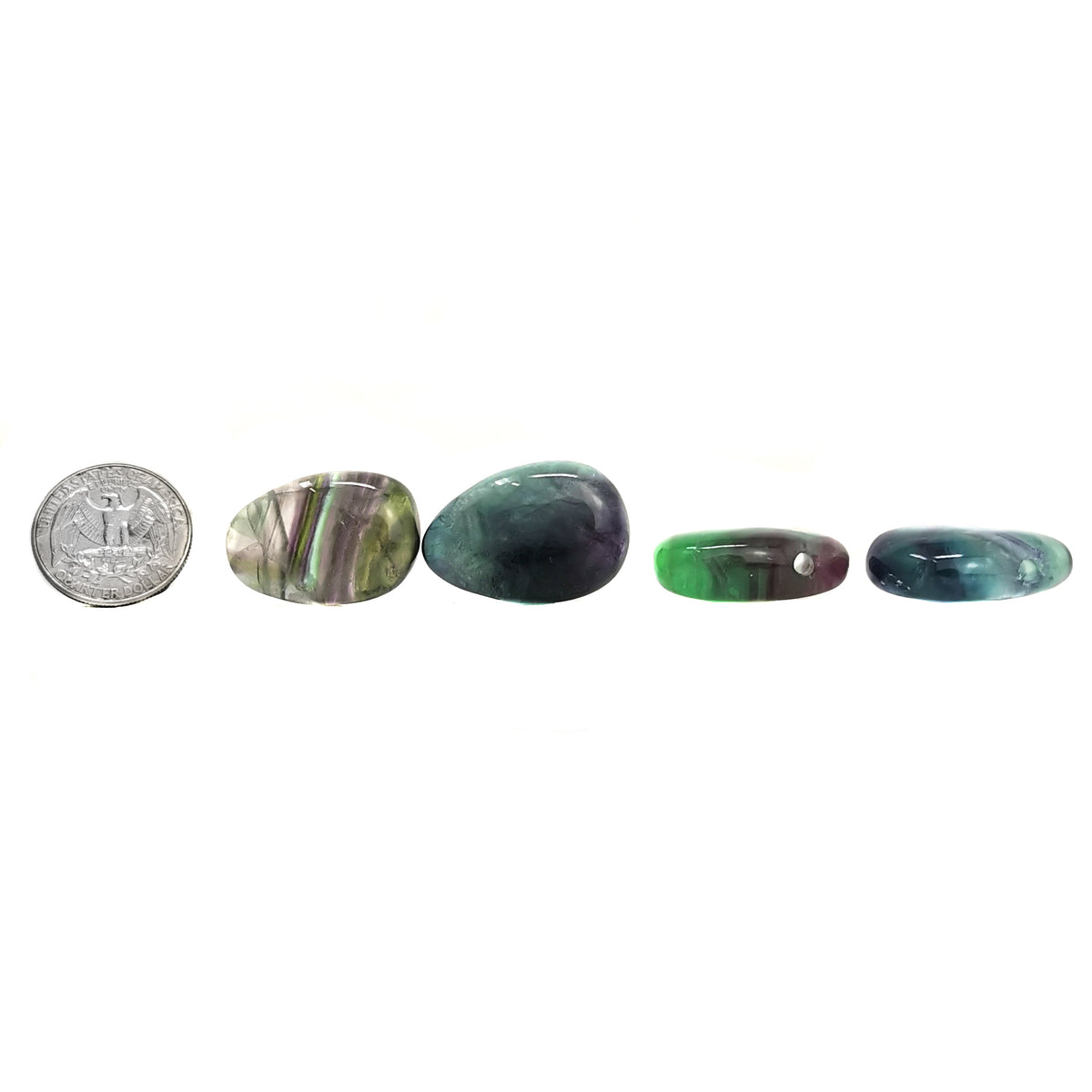 Drilled fluorite pendant – row beside a coin