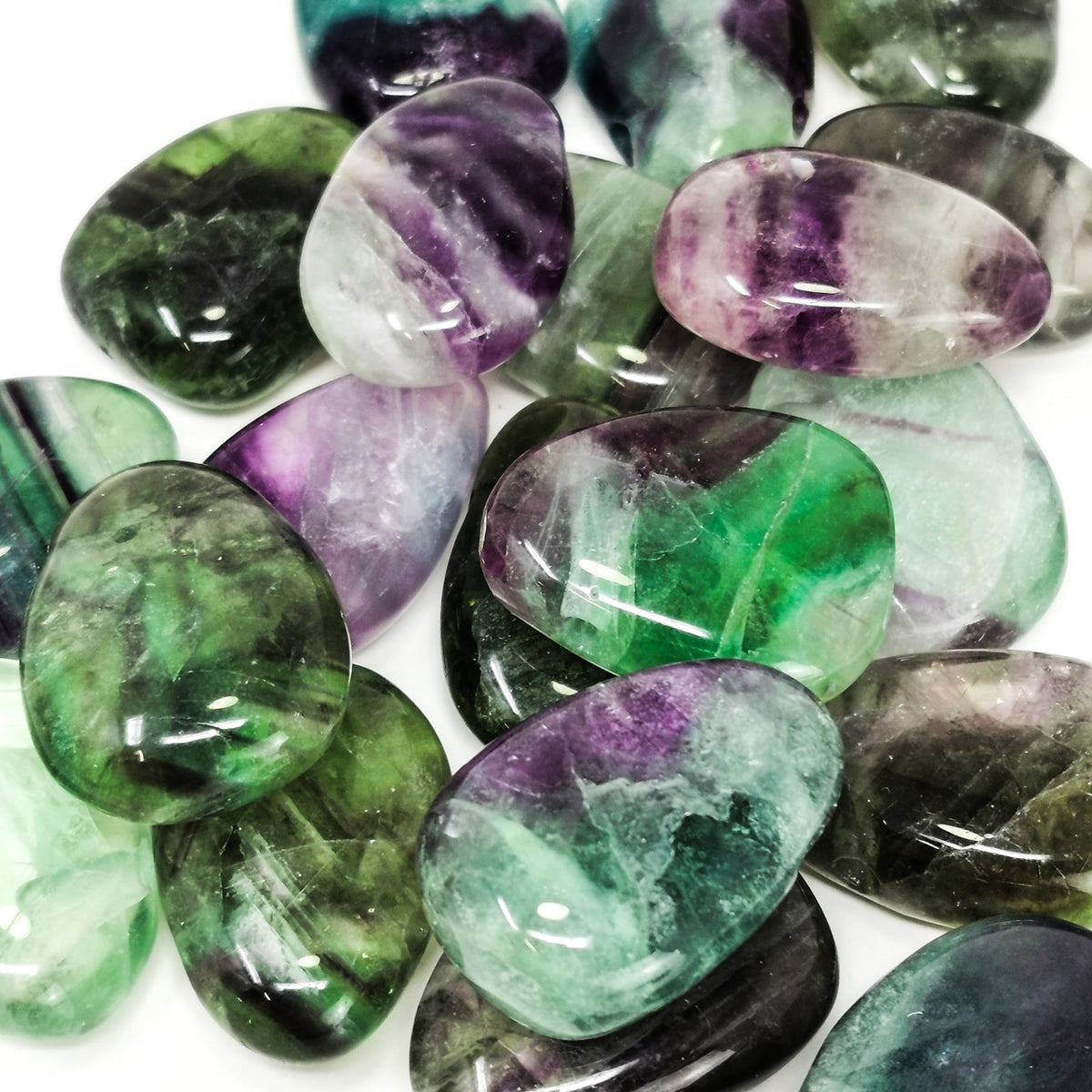 Drilled fluorite pendant – pile, close view