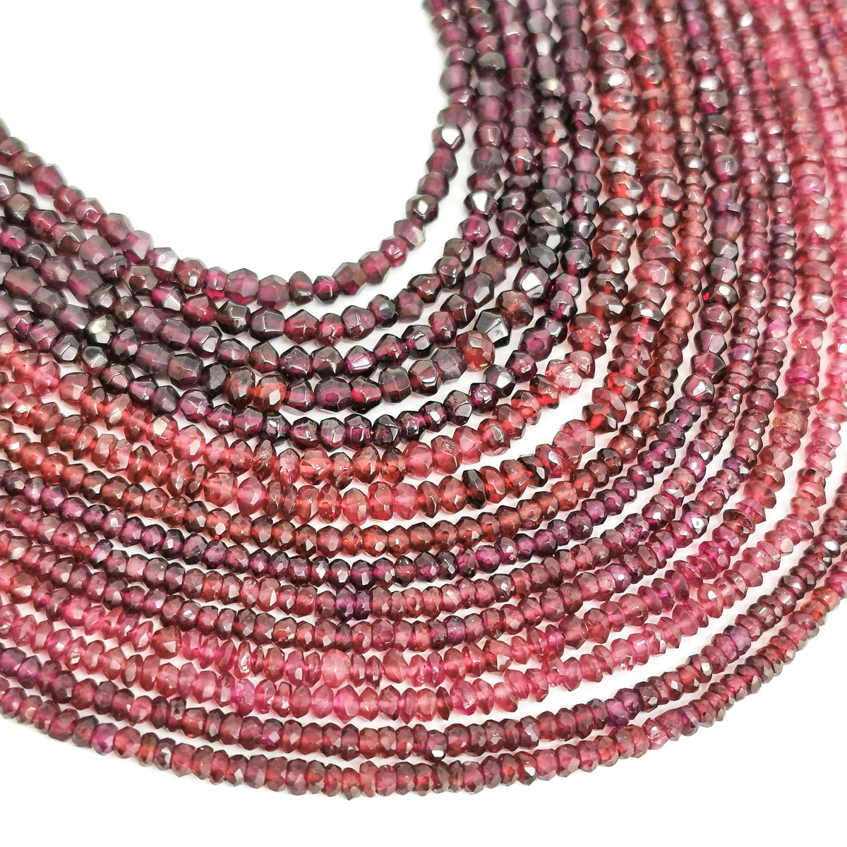 Garnet facet bead necklace in sterling silver and steel wire.