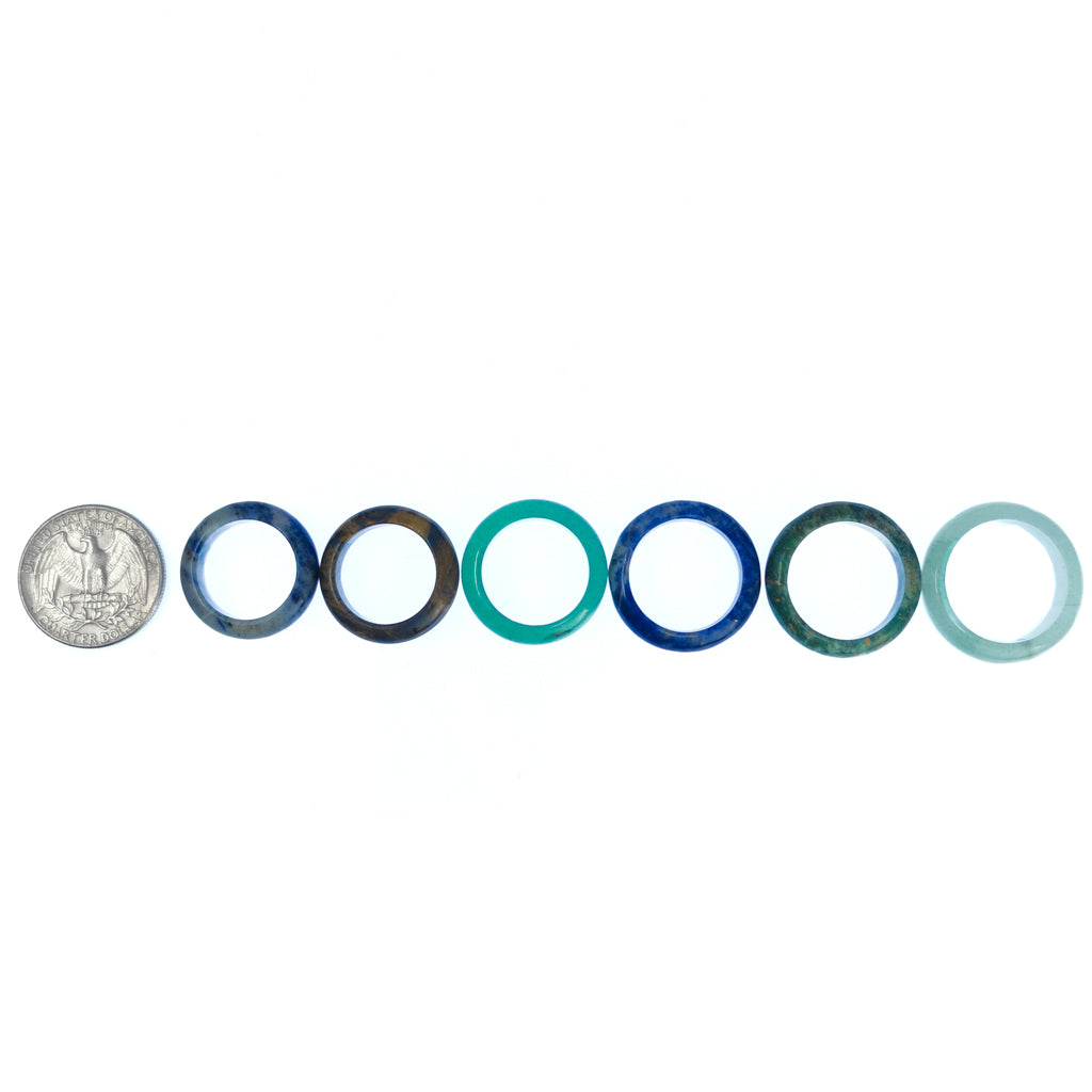 Gemstone ring – row beside a coin