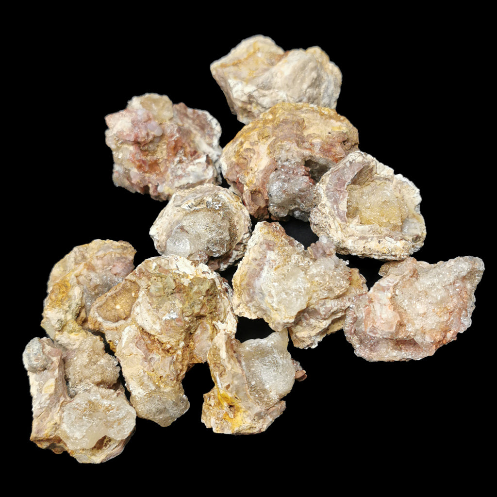 Hyalite opal, Hungary: pile of specimens on matrix