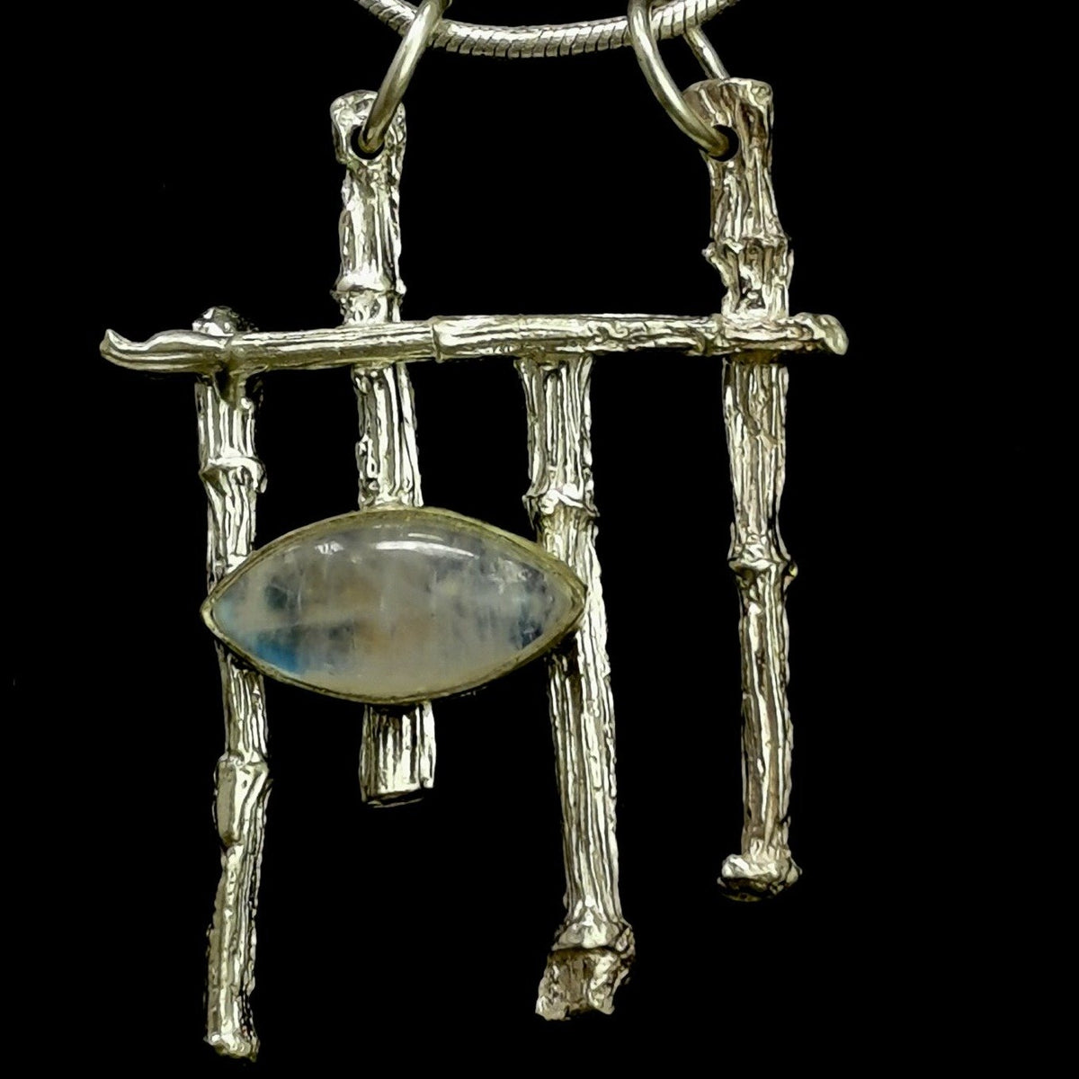 Twig & Moonstone pendant in sterling silver with Rainbow Moonstone.