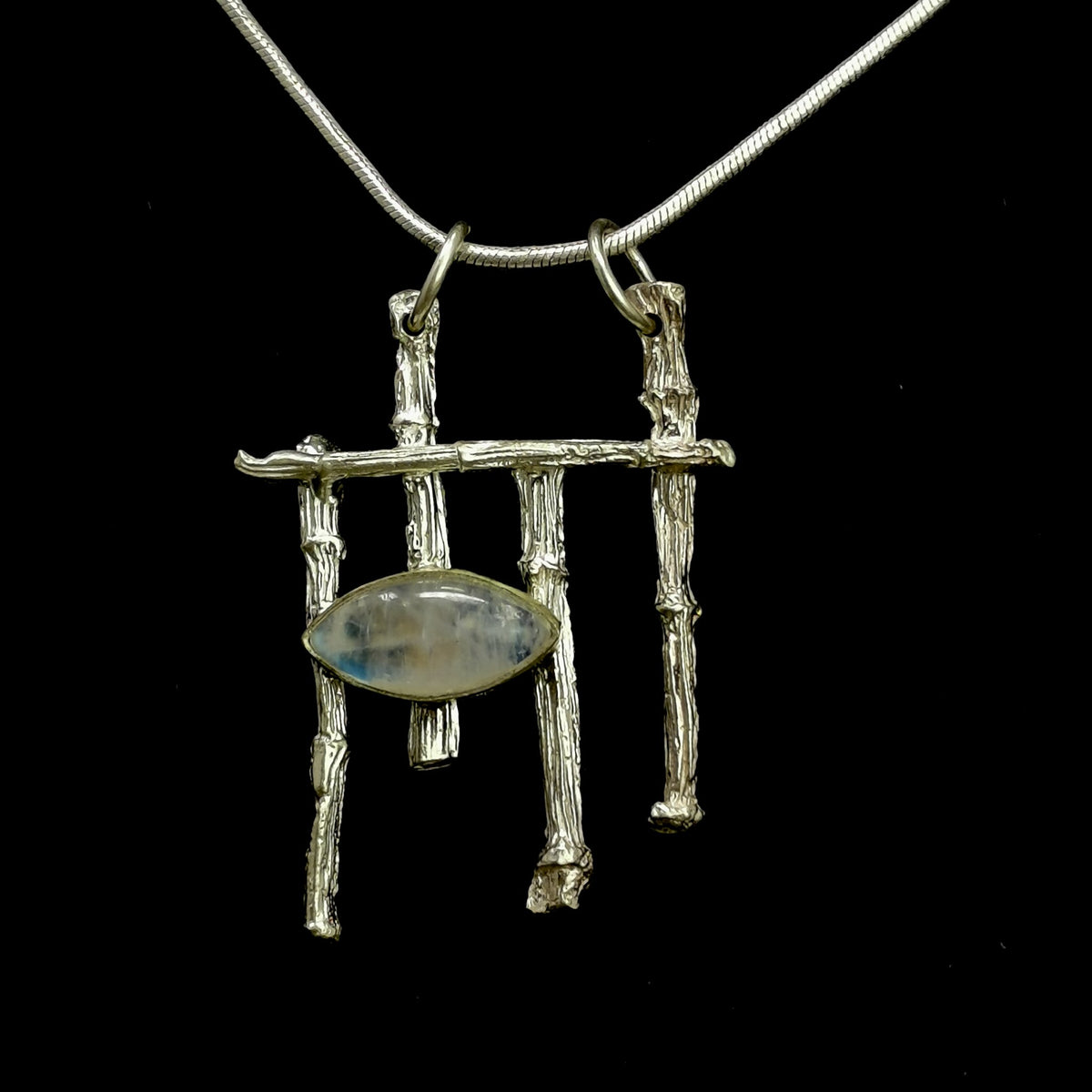 Twig & Moonstone pendant in sterling silver with Rainbow Moonstone.