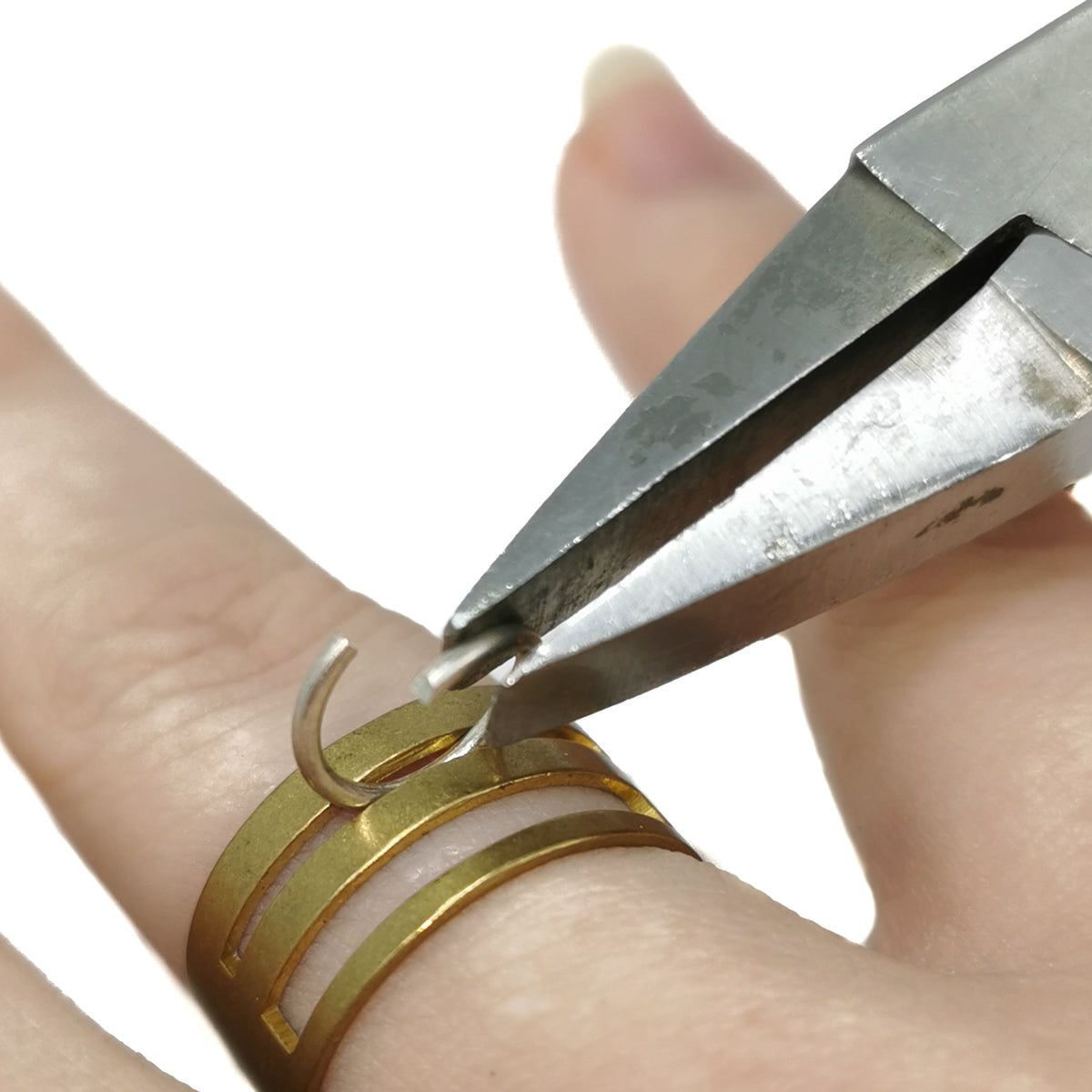 Jump Ring Closer smithing, made of brass.