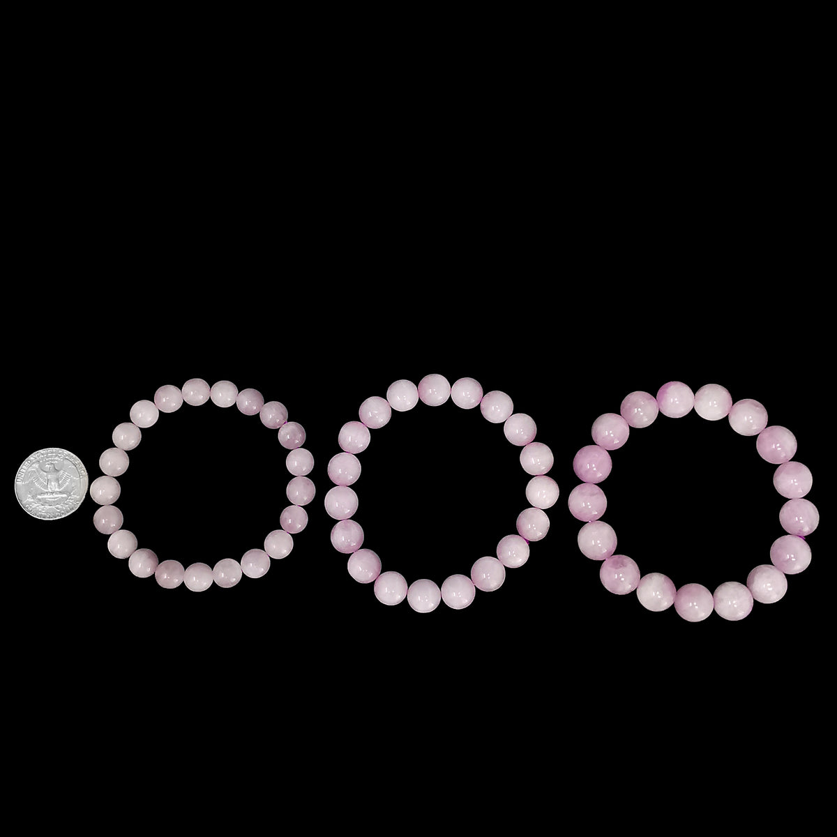 Kunzite bead bracelet from Pakistan – three sizes beside a coin