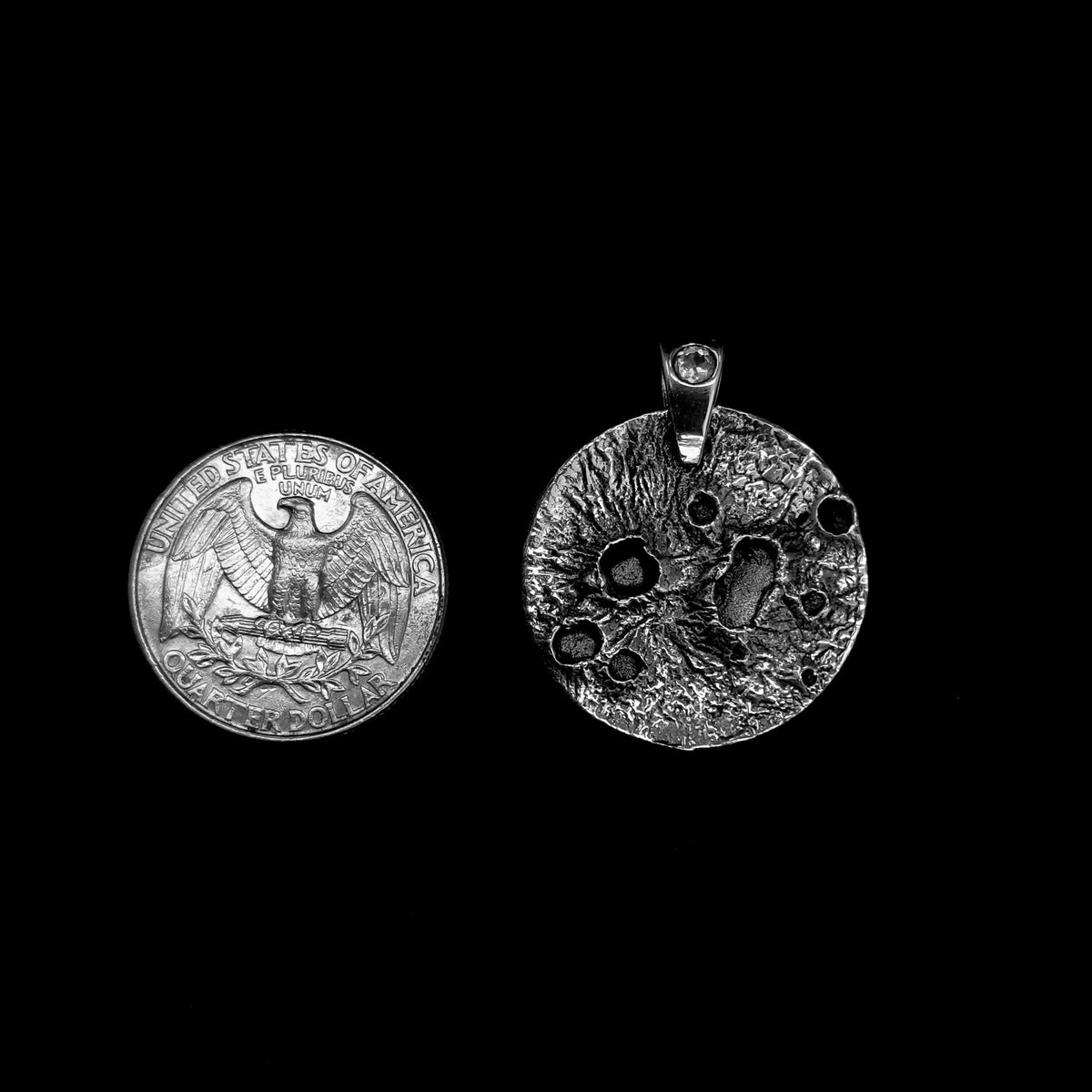Broken Ox moon pendant, sterling silver: beside a coin