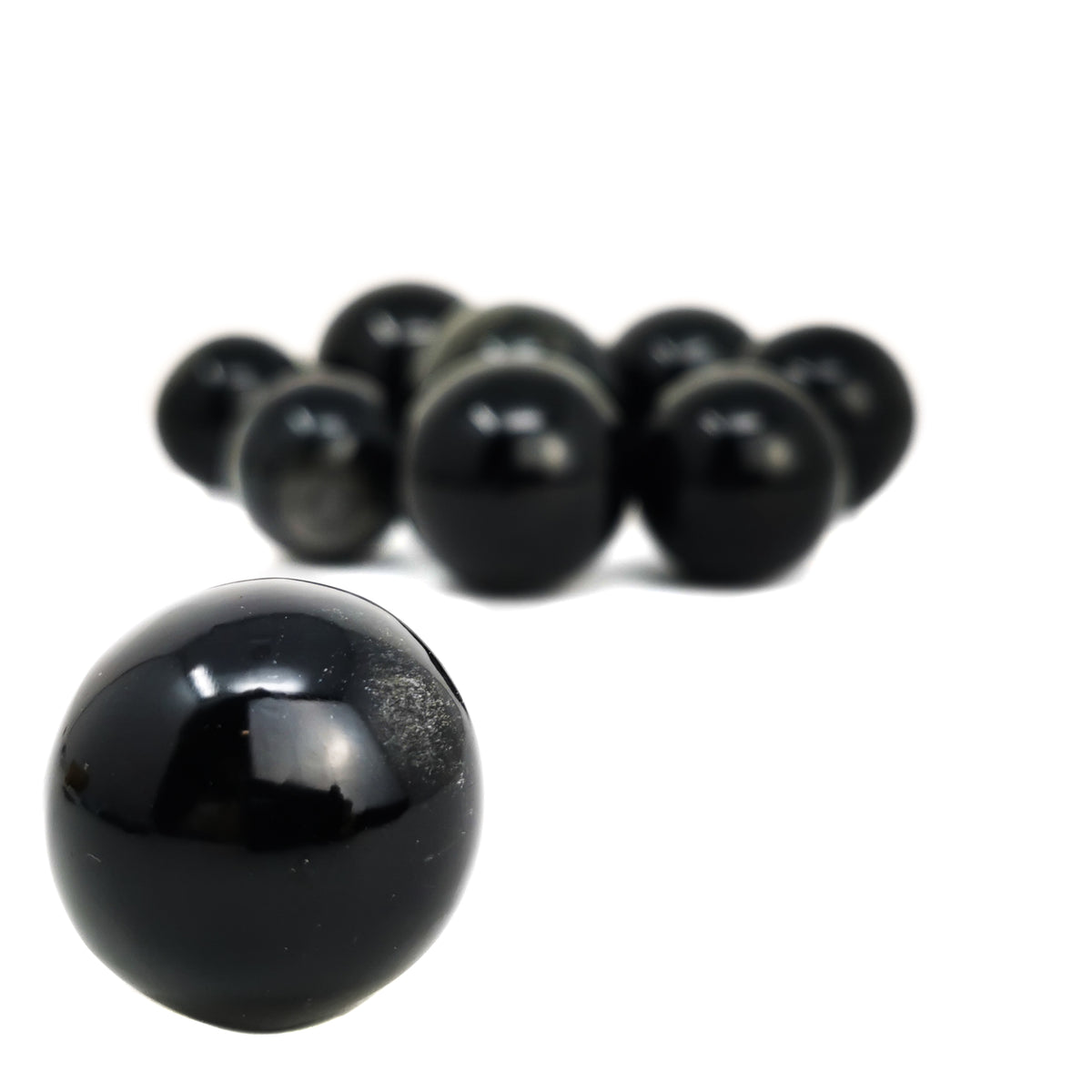 Obsidian sphere, a volcanic glass, from Mexico.