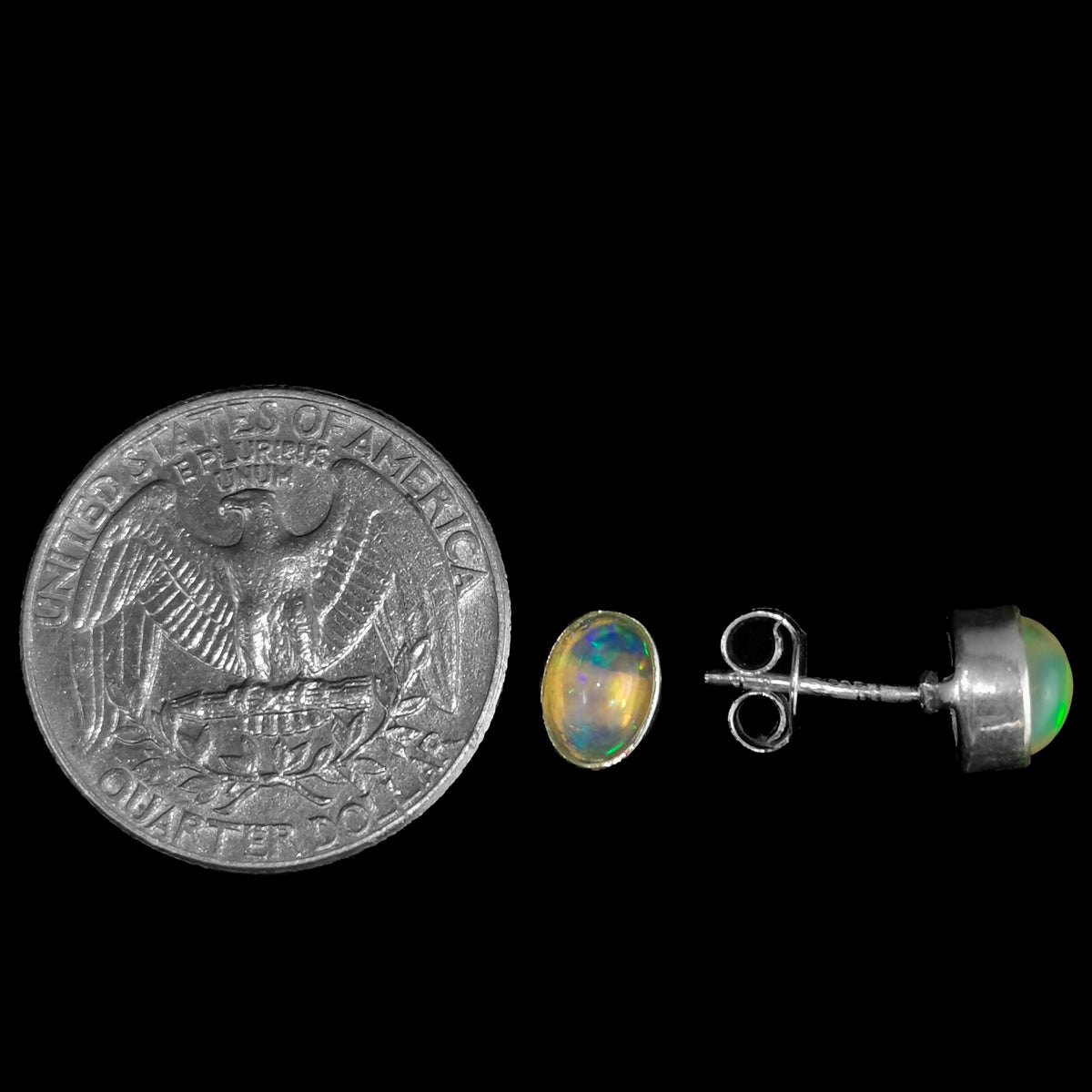 Ethiopian opal oval stud earrings – pair beside a coin for scale