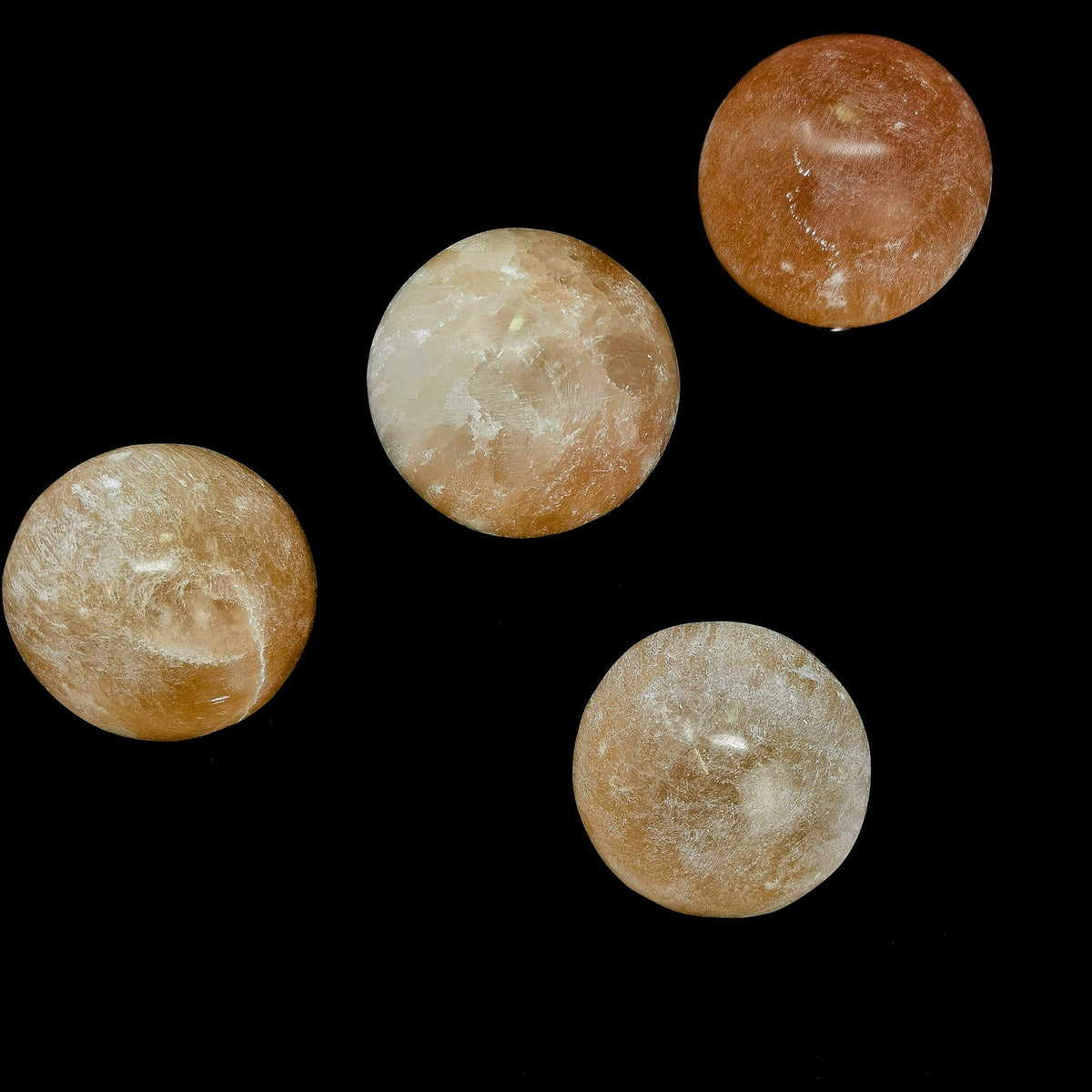 Orange Selenite sphere, a variety of gypsum, from Morocco.