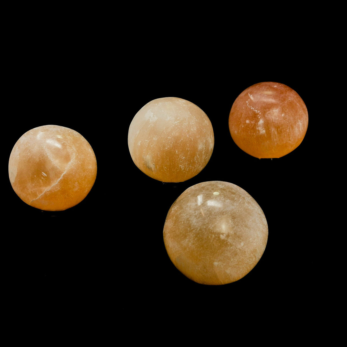 Orange Selenite sphere, a variety of gypsum, from Morocco.
