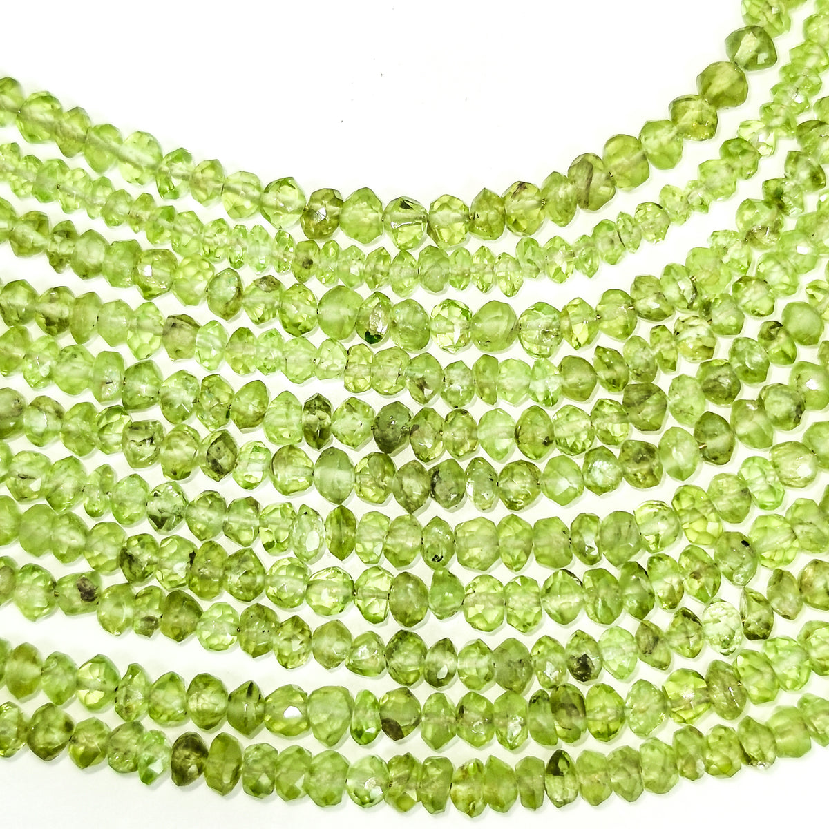 Peridot small facet bead necklace in sterling silver and steel wire.