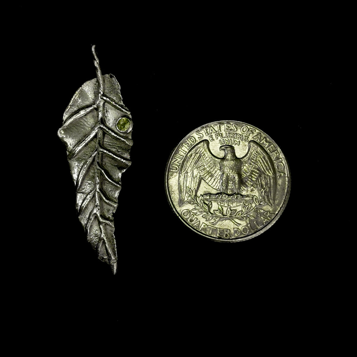 Peridot Leaf pendant in sterling silver with Faceted Peridot.