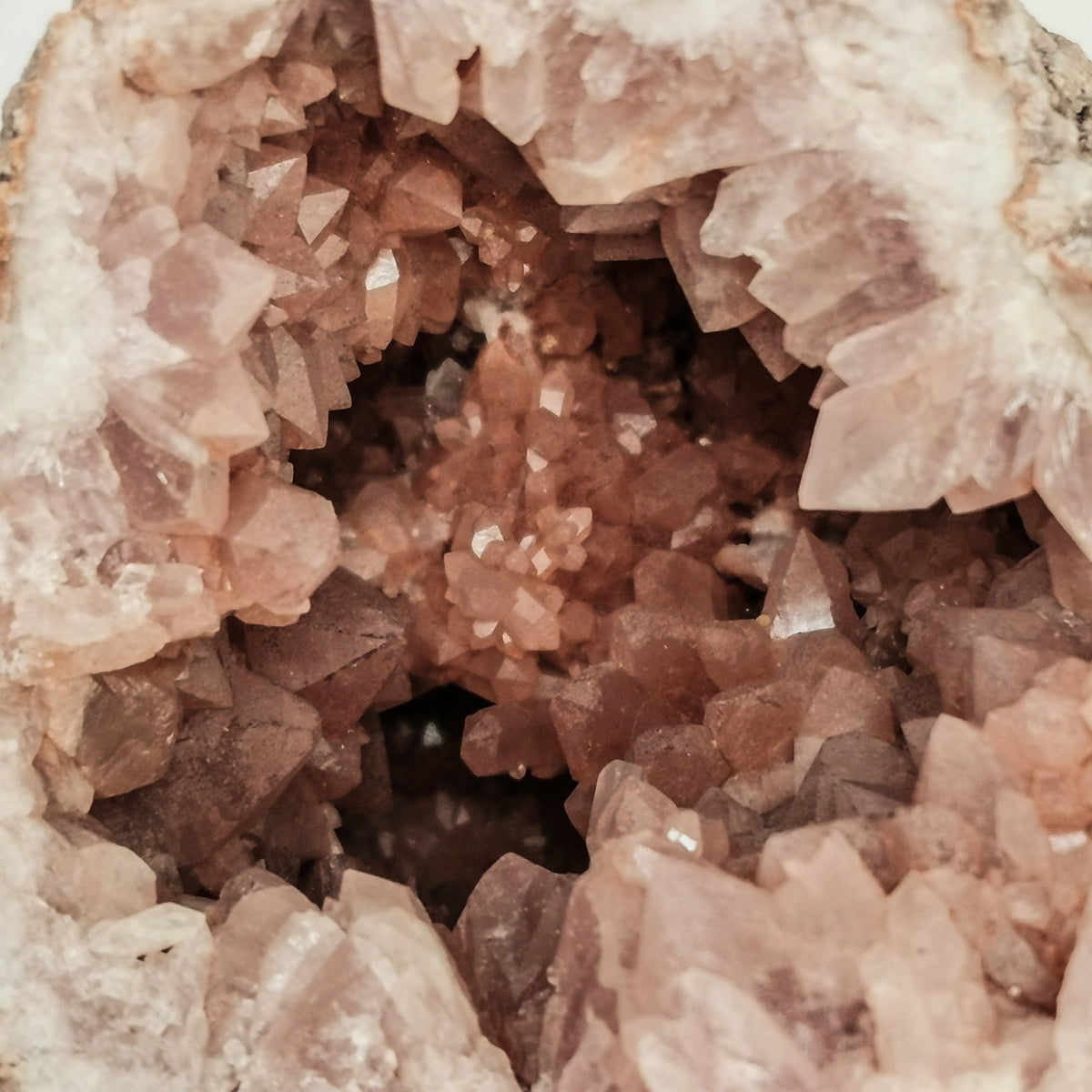 Pink amethyst geode half from Argentina – close-up of pink crystals