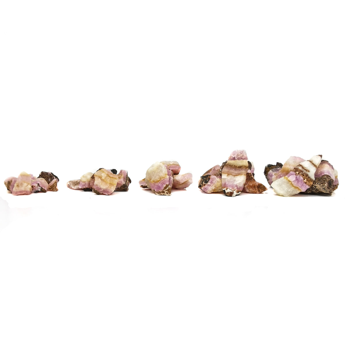 Pink calcite, Pakistan: row of sizes