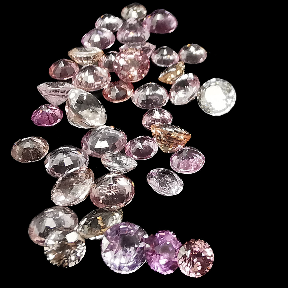 Pink Sapphire facet, a variety of corundum.