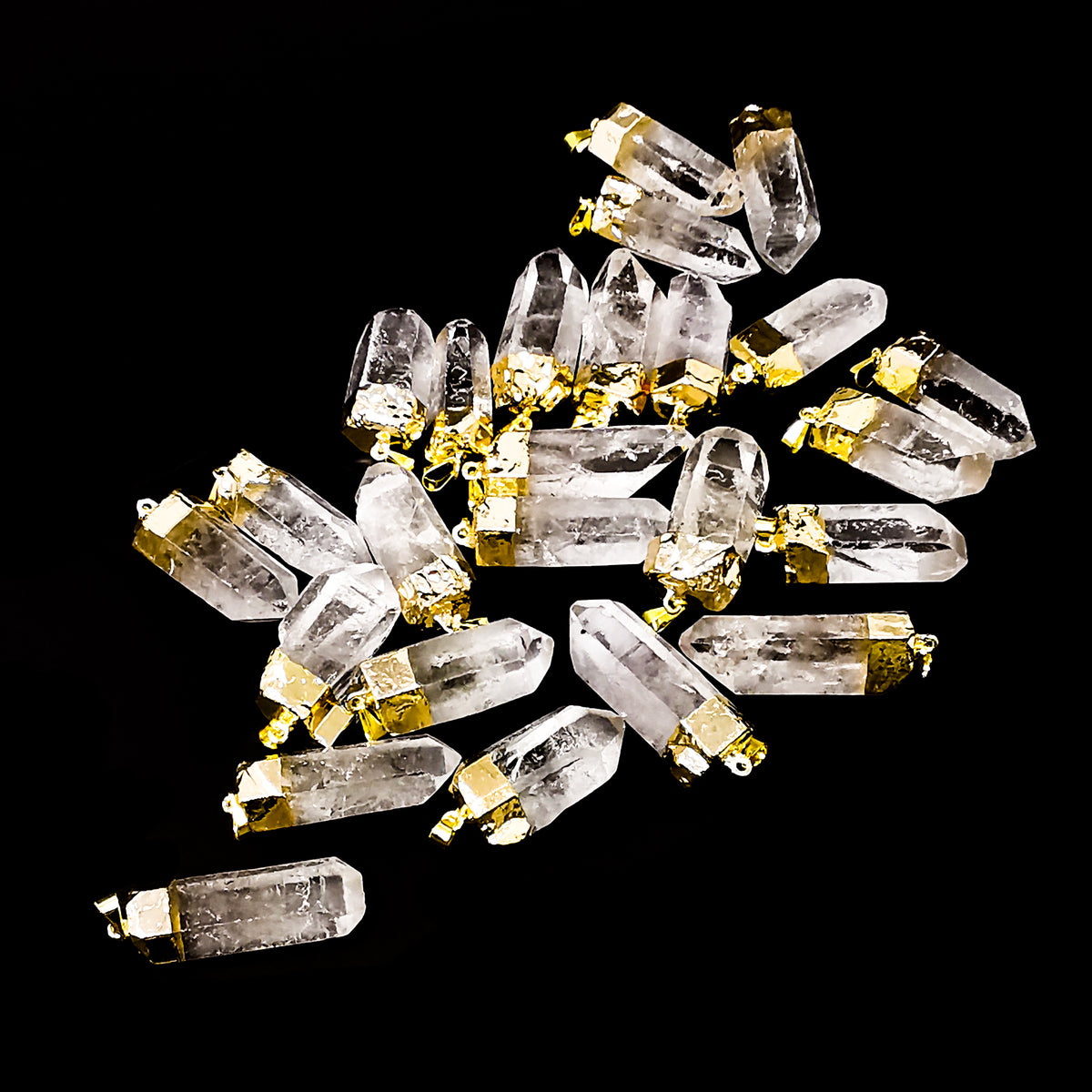 Raw clear quartz point pendant – pile of pendants