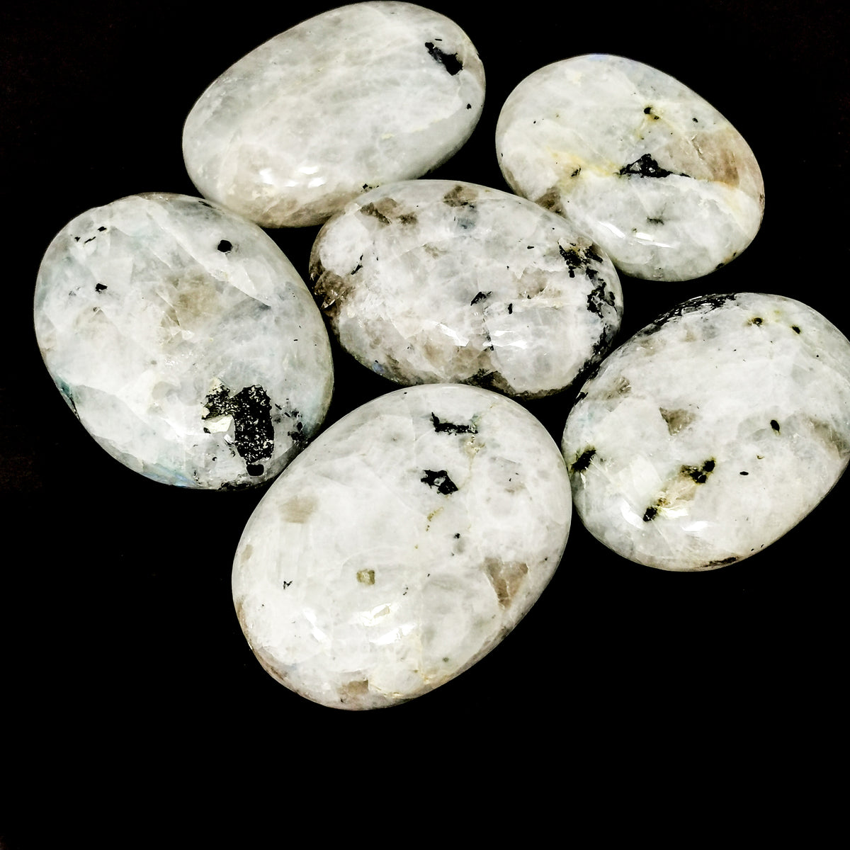 Rainbow Moonstone palm stone, a feldspar.