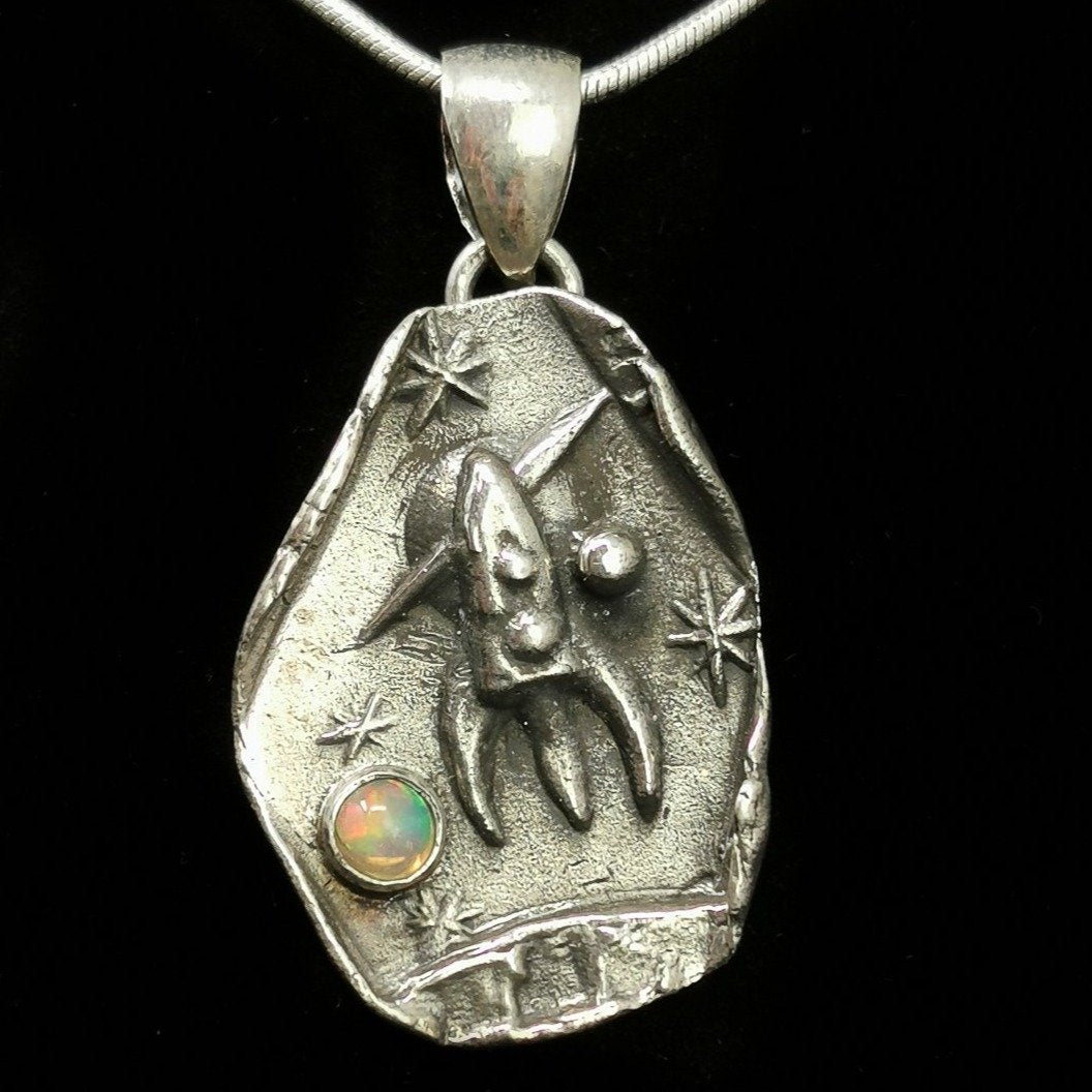 Rocket Ship Over Saturn pendant in sterling silver with Ethiopian Opal.