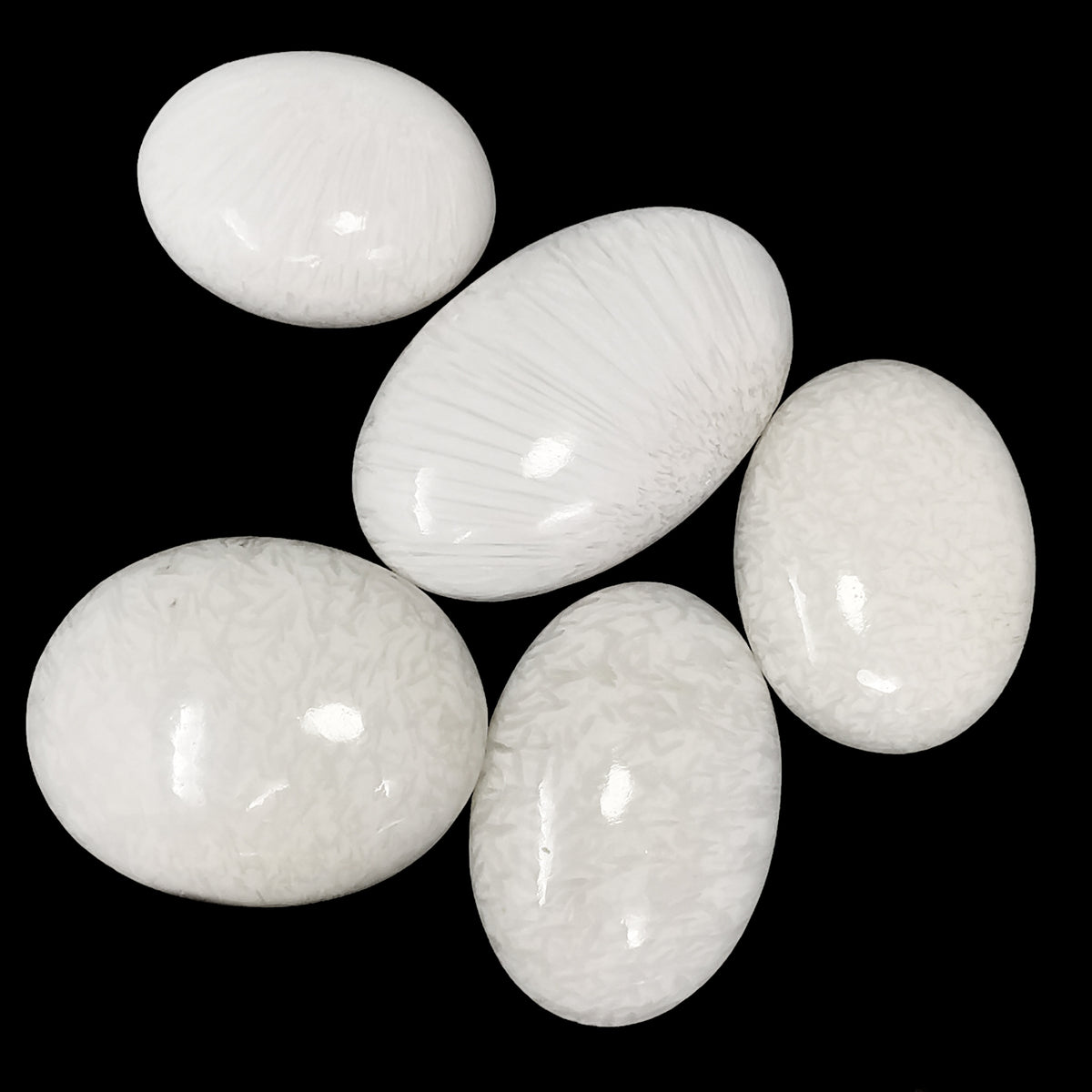 Scolecite palm stone from India.