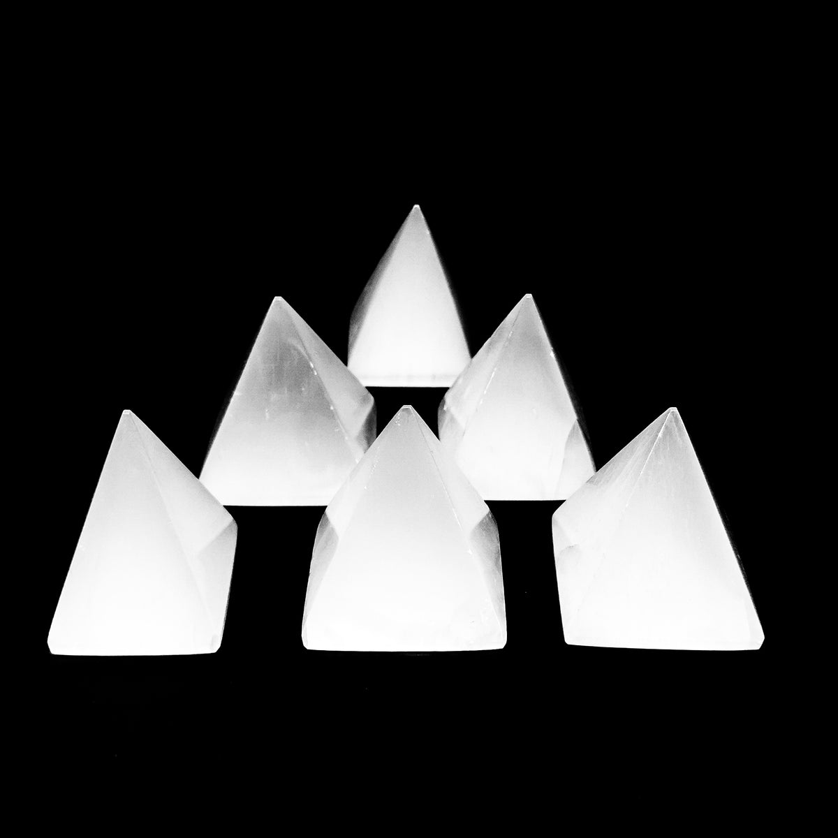 Selenite pyramid, a variety of gypsum, from Morocco.