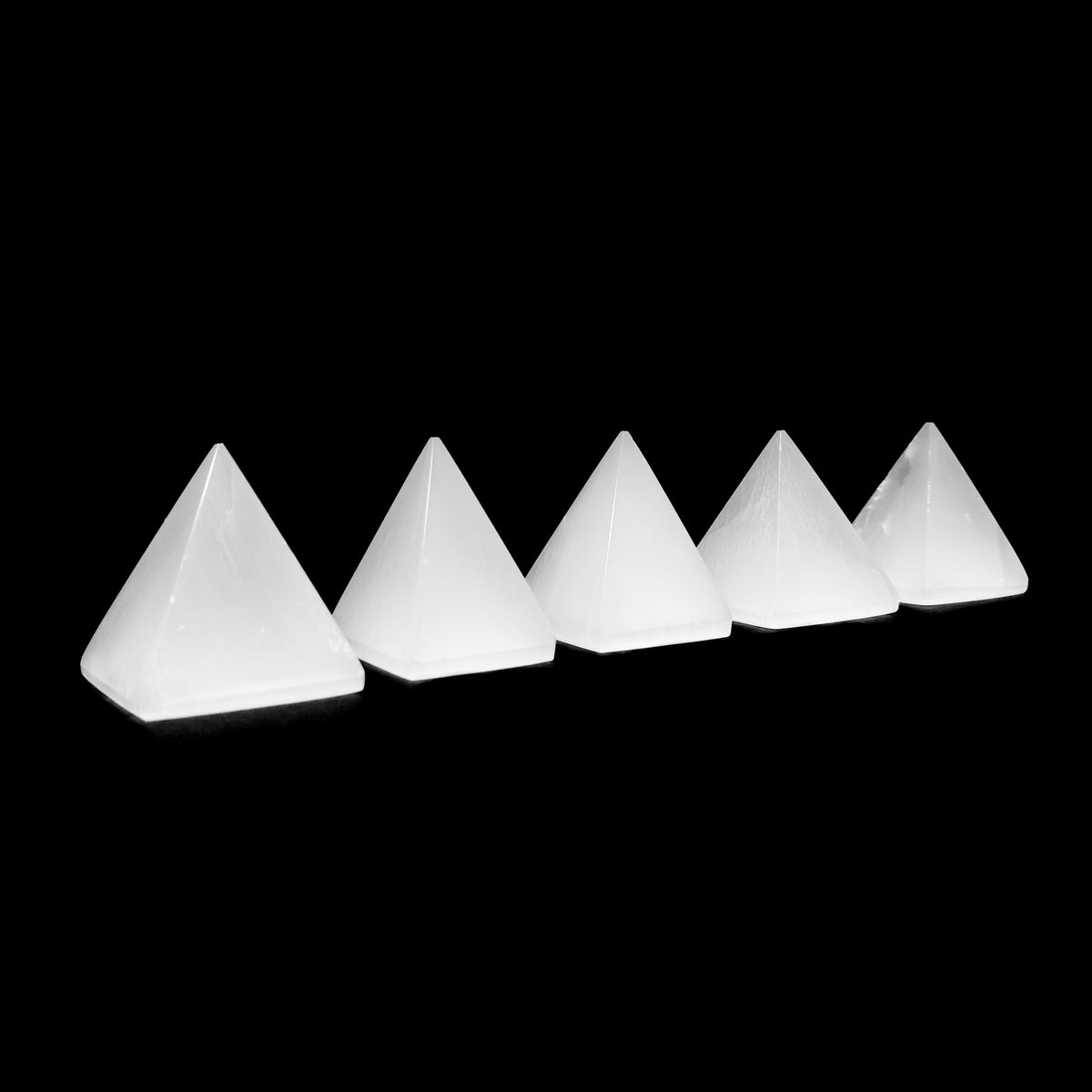 Selenite pyramid, a variety of gypsum, from Morocco.