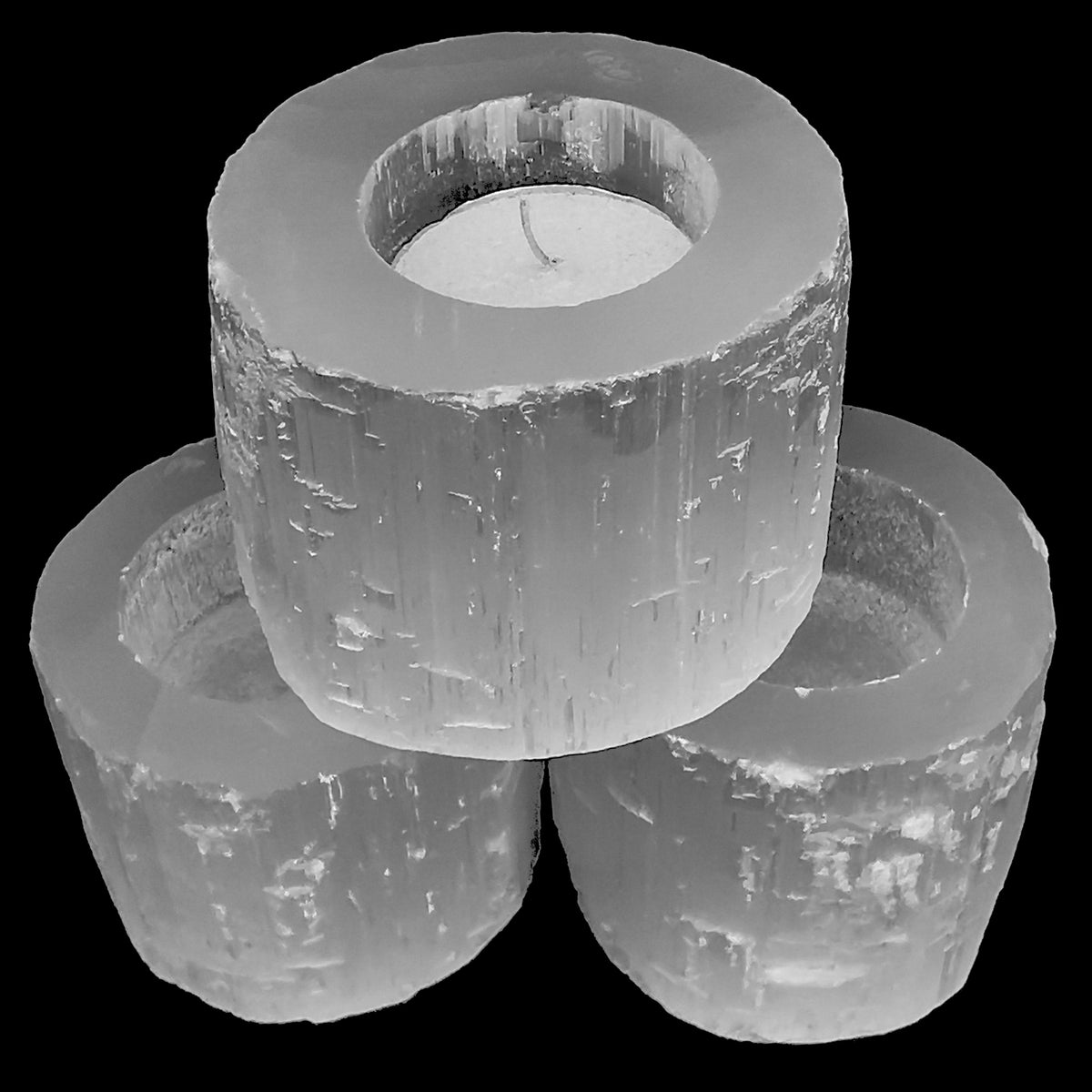 Selenite raw edge candle holder, a variety of gypsum, from Morocco.