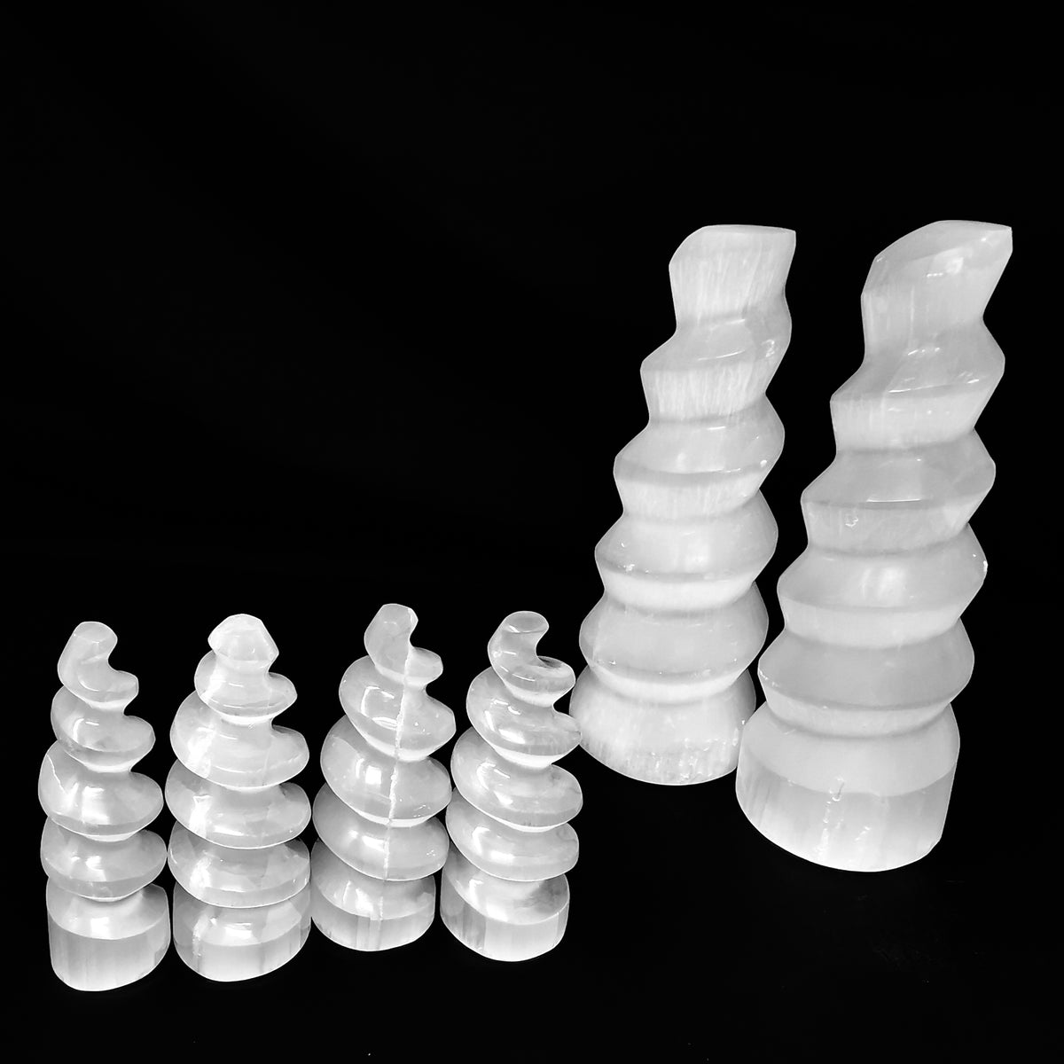 Selenite spiral tower from Morocco – row of small and large towers