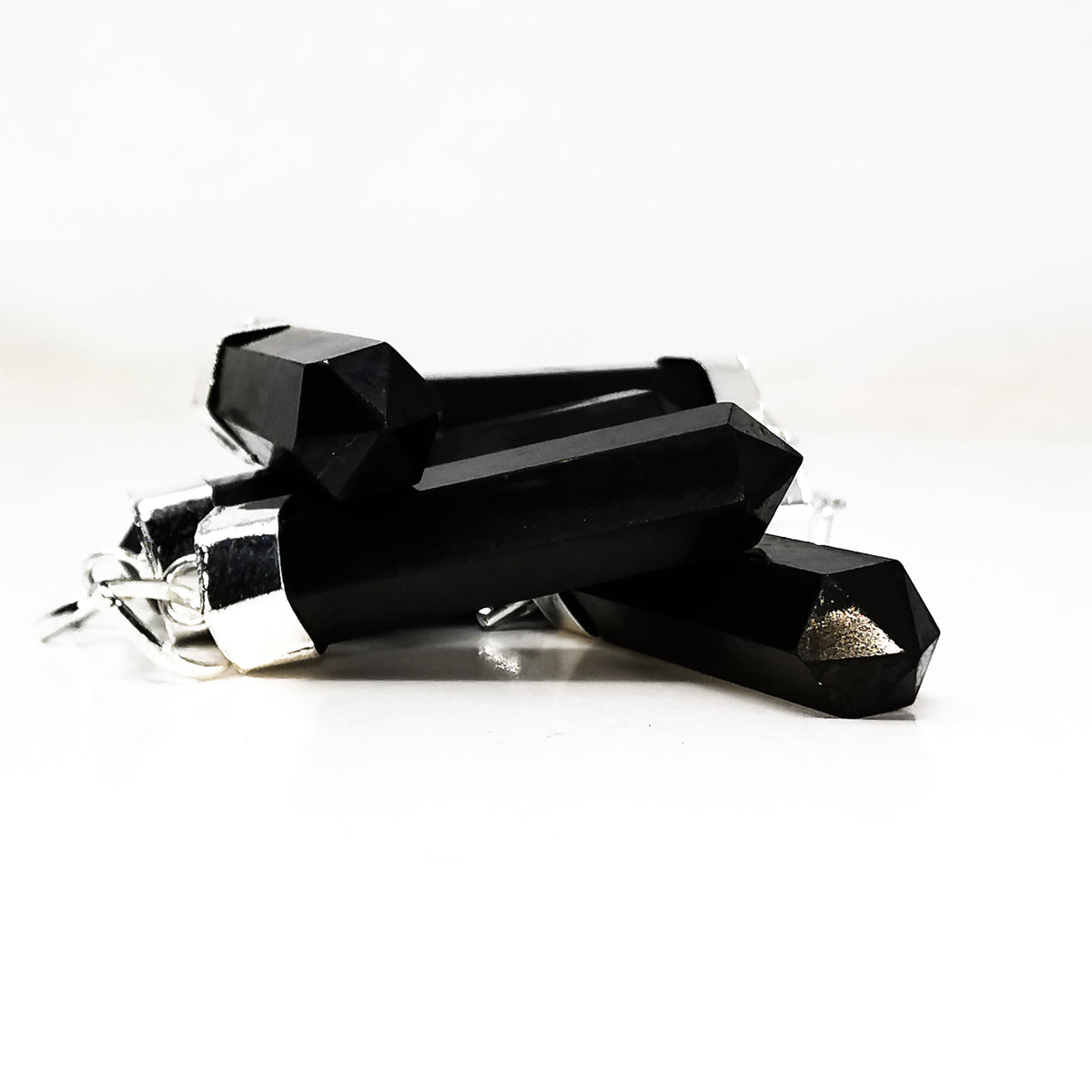 Shungite Capped Crystal pendant in fine silver-plated base metal.