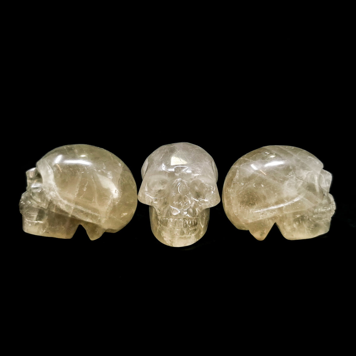 Smoky quartz skull: three skulls at an angle